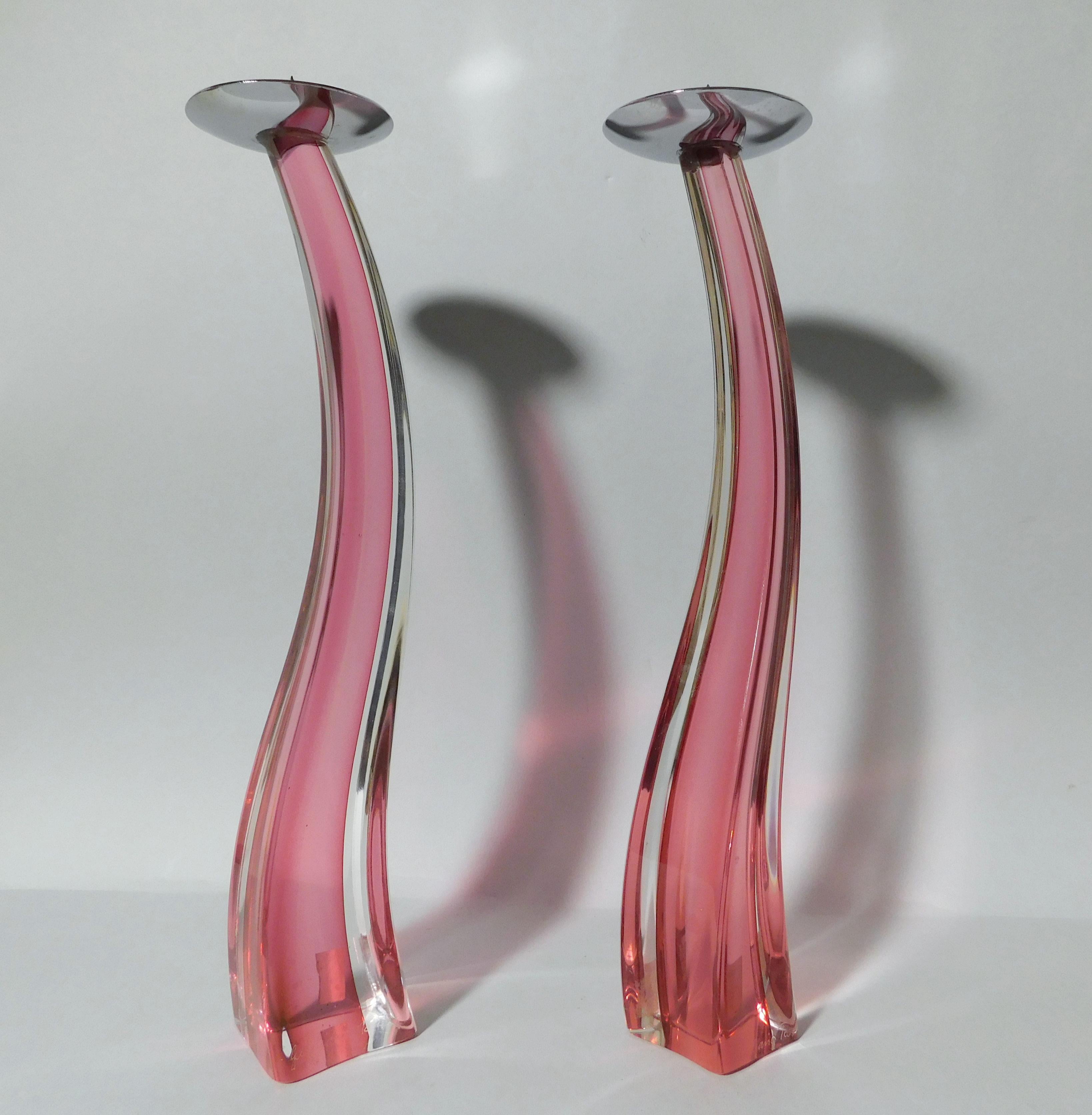 Italian curved Murano candlestick hand blown in pink and clear glass, made in Italy by Giuliano Tosi, circa 1980s 
Original maker's mark on the base
Measures: height 13 inches and 12.5 inches, diameter 2.5 inches
A pair available in stock in
