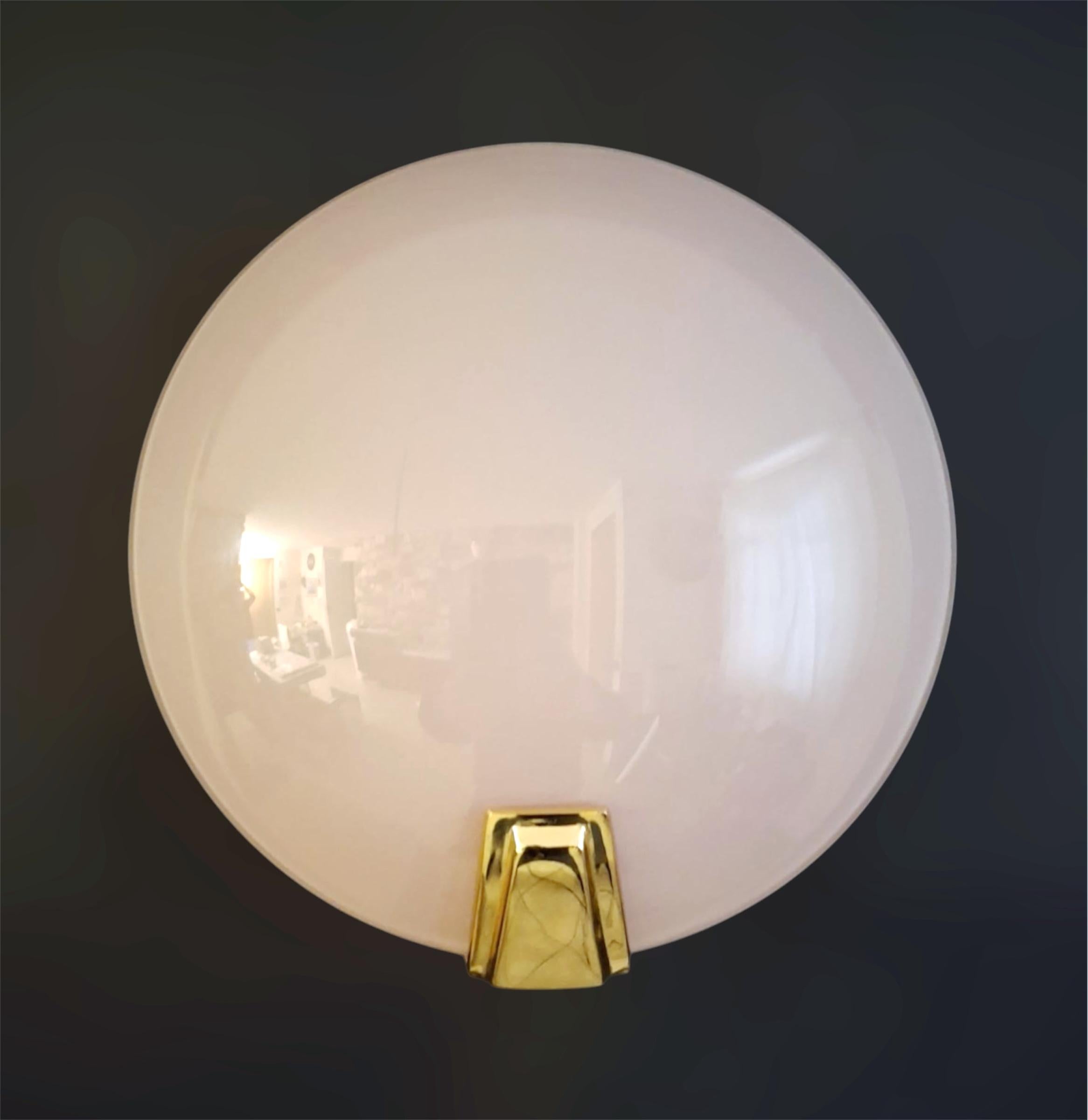 Vintage Italian wall light with a pink round Murano glass shade on gold plated metal frame / Made in Italy circa 1980s 
Measures: width 9 inches, height 9.5 inches, depth 4 inches
1 light / E26 or E27 type / max 60W
1 pair available in stock in