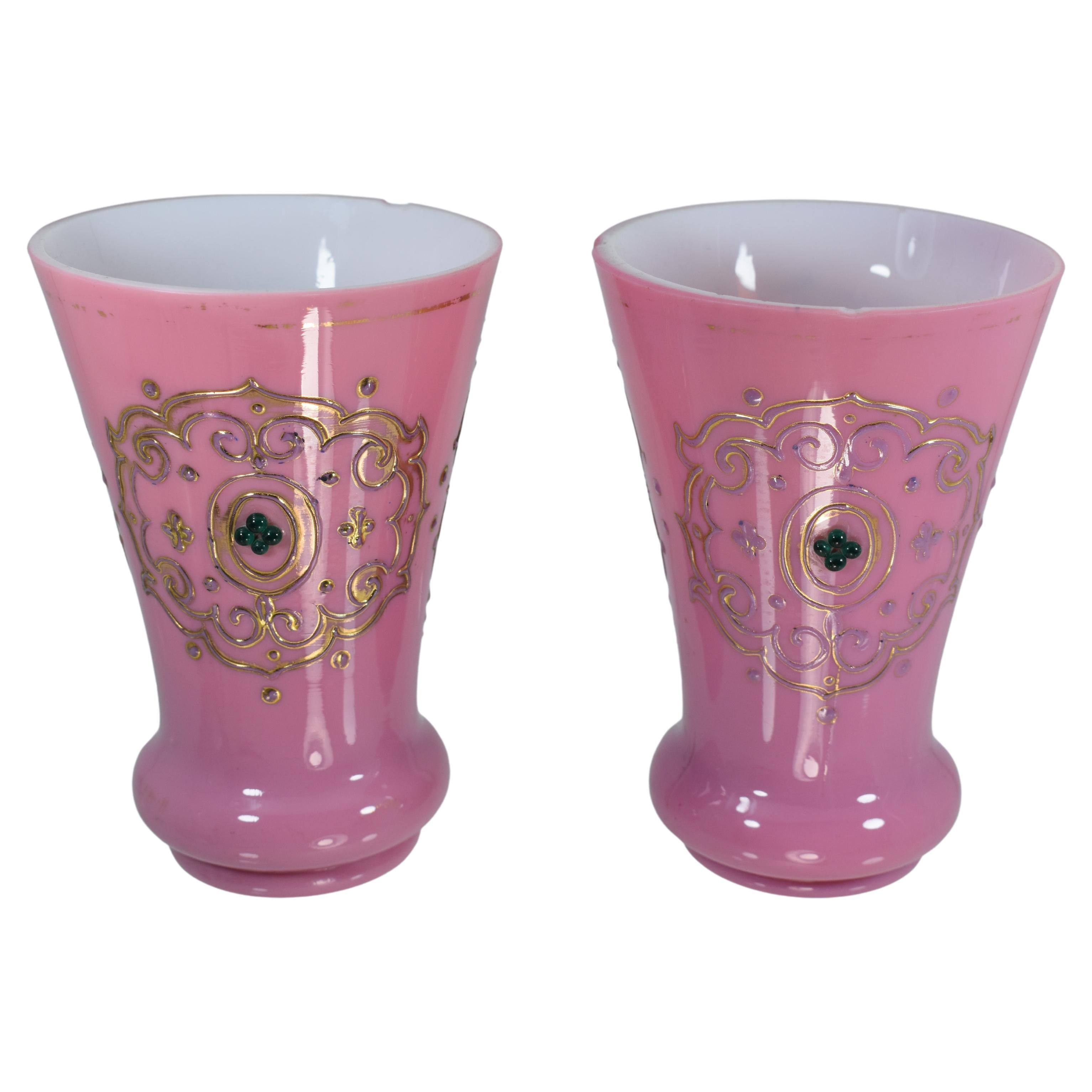 Pair of overlaid opaline glass cups
Beautiful pink color and a milkly white inner layer
Rich gilding and enamel decoration
Made in 19th Century for the Ottoman market
13 cm high