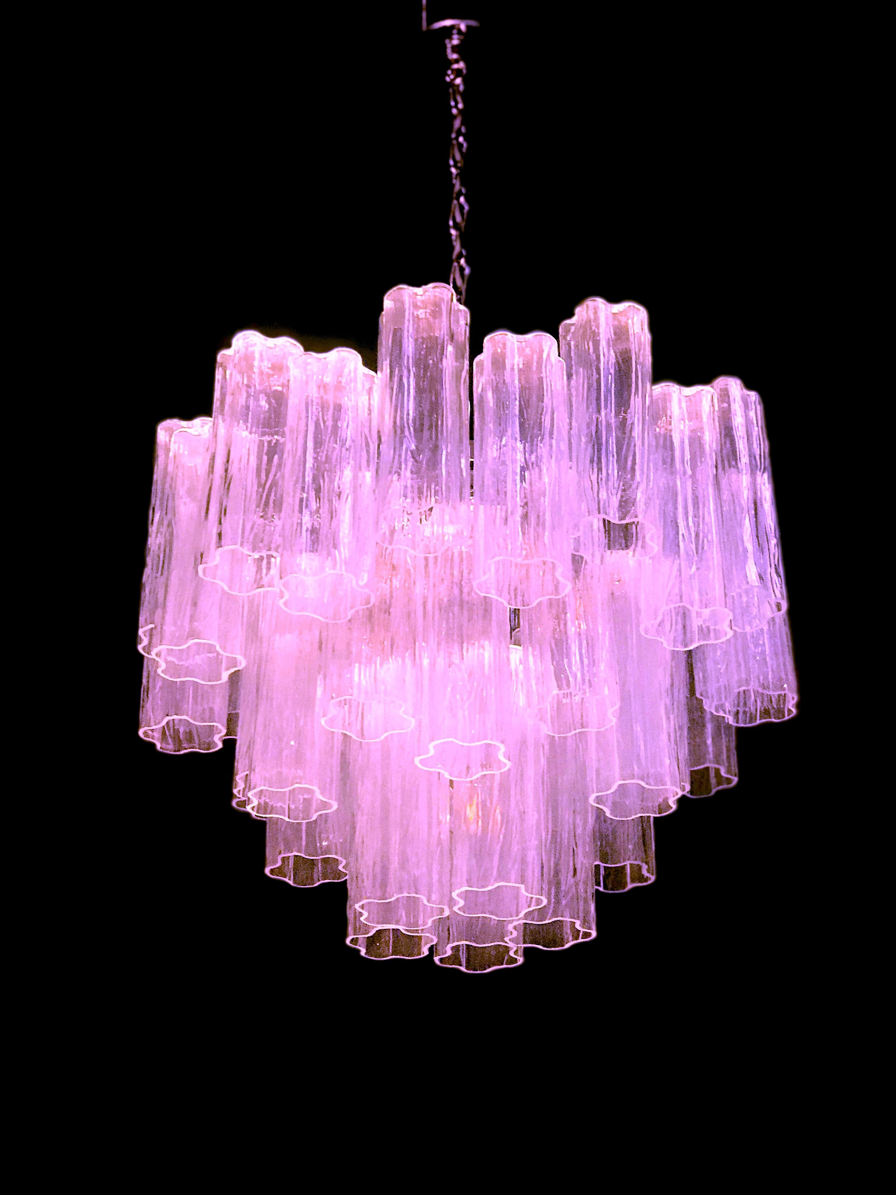 Each chandelier includes precious pink tronchi Murano glasses 20 cm long.
Nickel-plated metal structure on three levels,
Perfect vintage condition.
Available 8 chandeliers and 4 pairs of sconces.



 