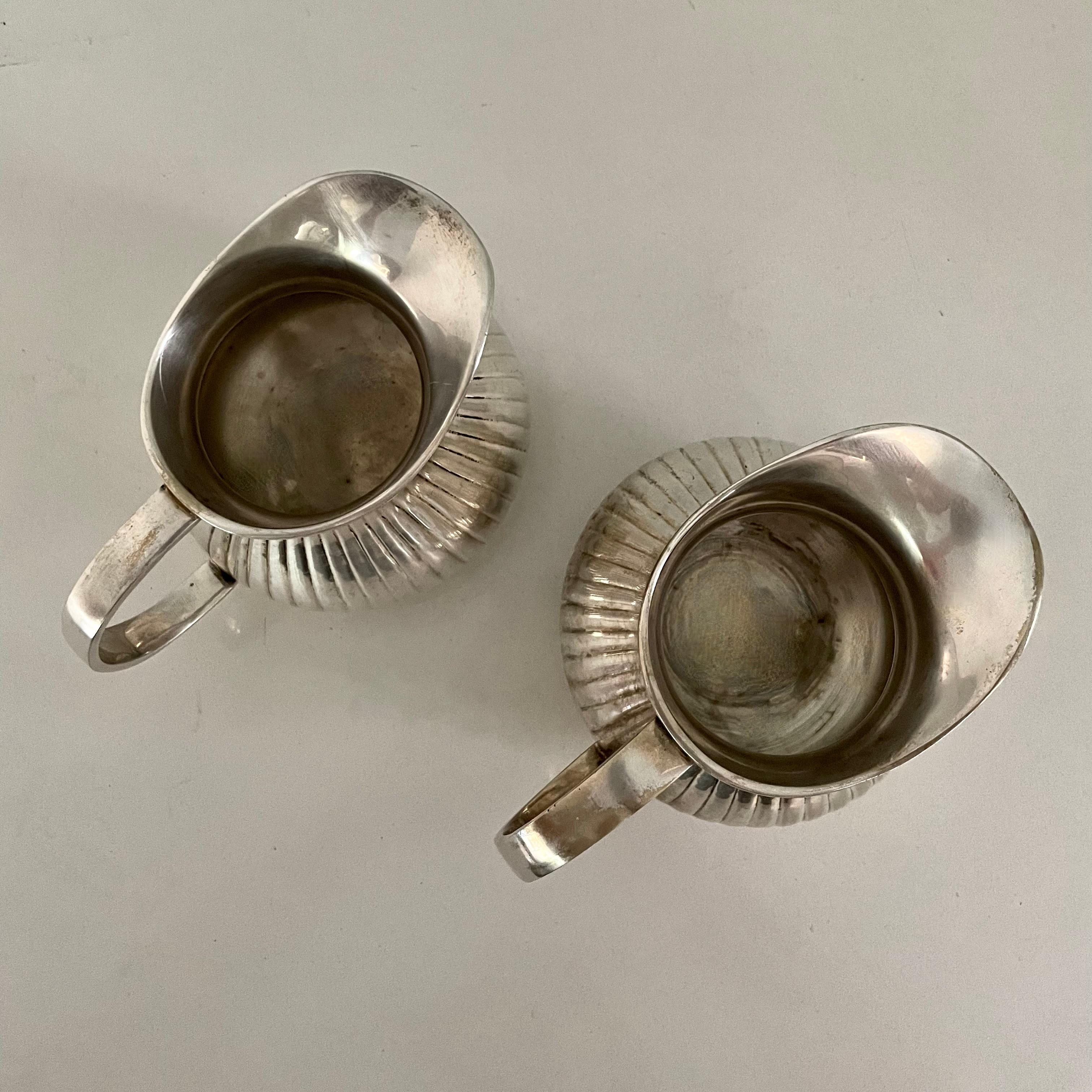 Pair of Pinstriped Silver Pitchers For Sale 10
