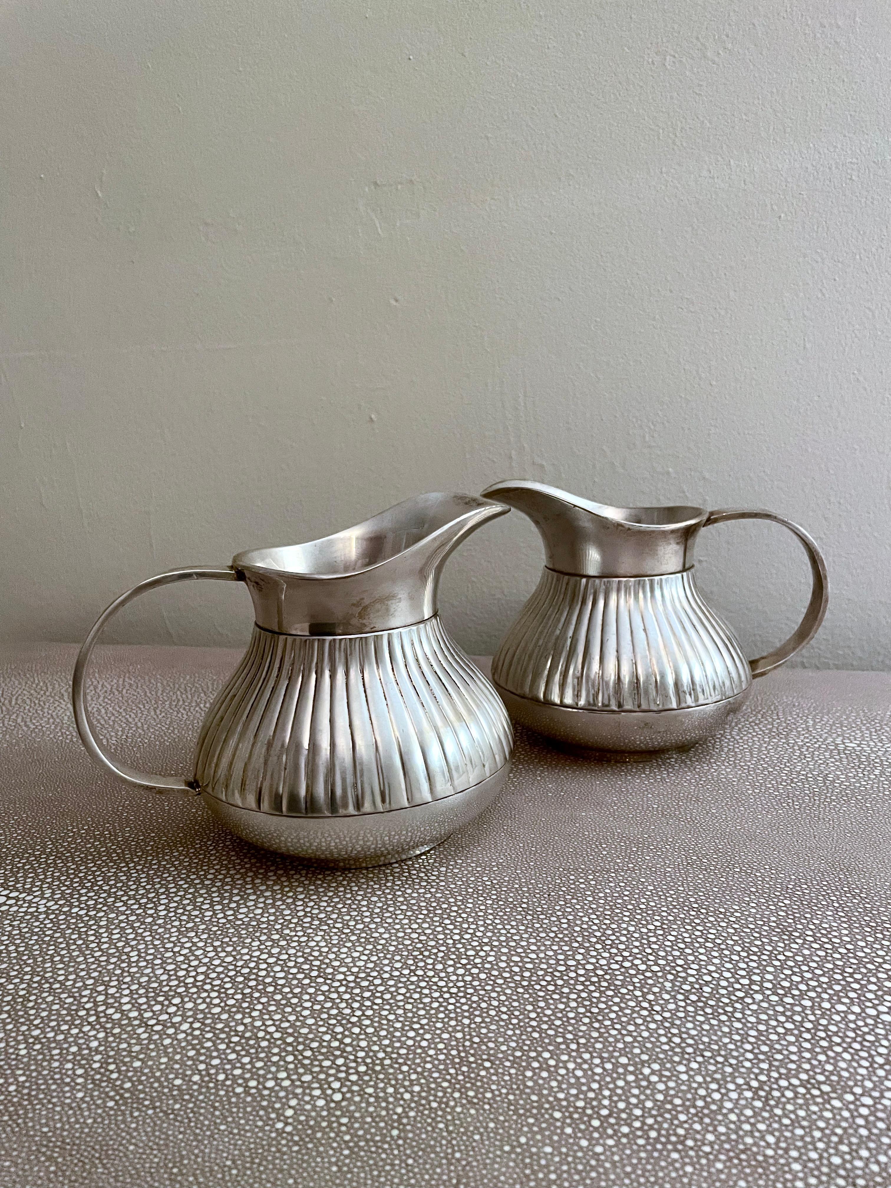 20th Century Pair of Pinstriped Silver Pitchers For Sale