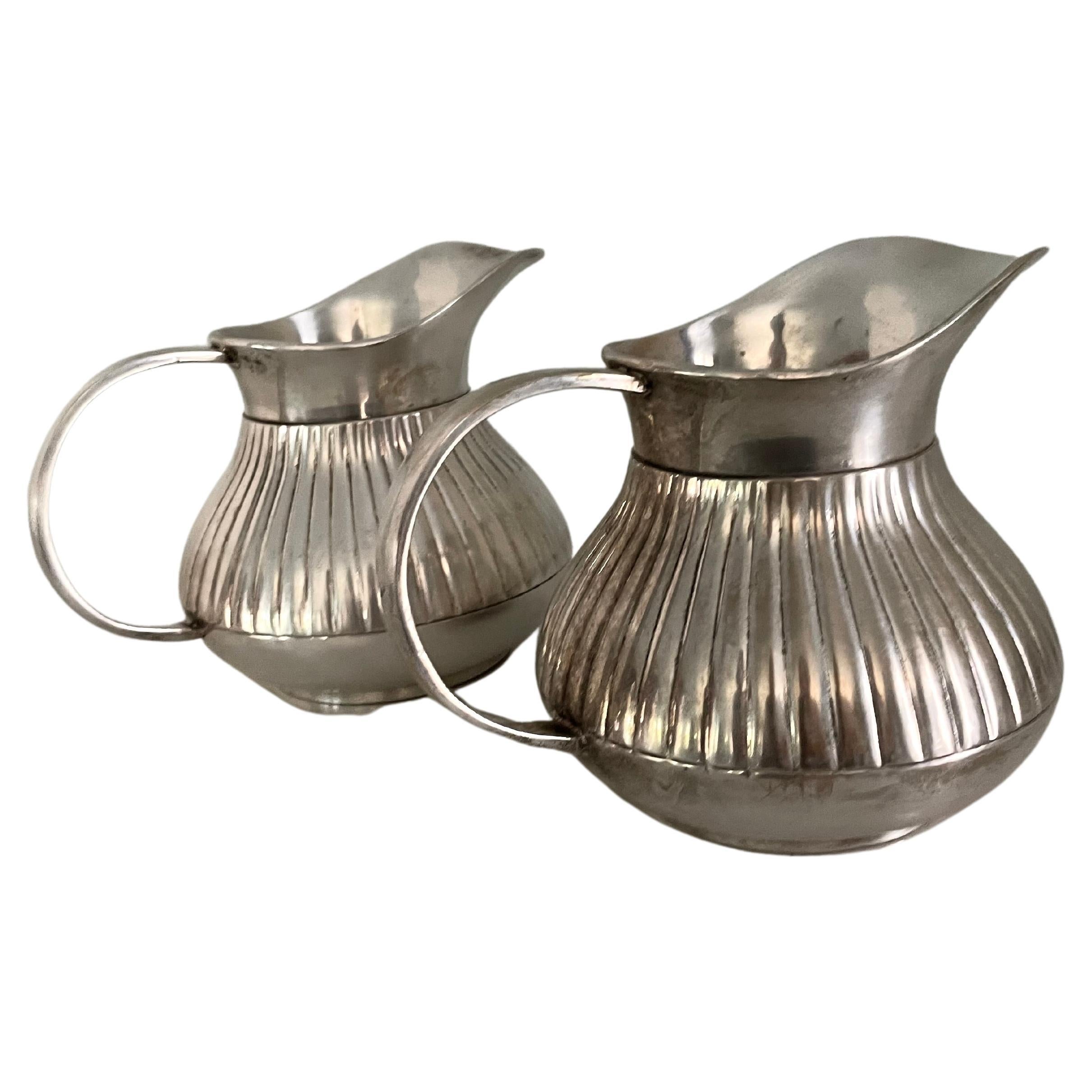 Pair of Pinstriped Silver Pitchers For Sale