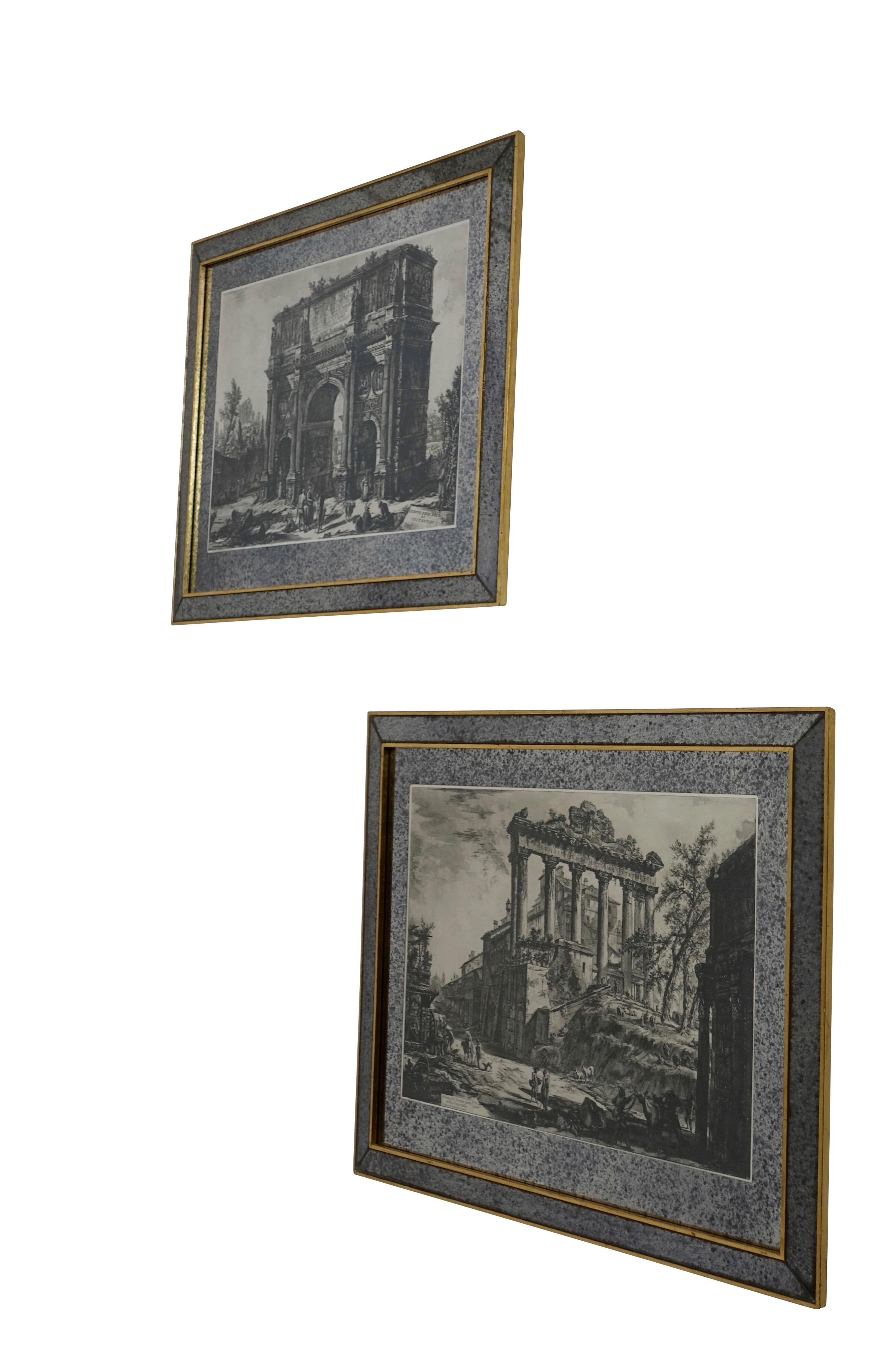 Pair of black and white Piranesi prints framed in silver mirror with speckling and an outer fillet of giltwood and matted in the same manner, Italy, 1950s.