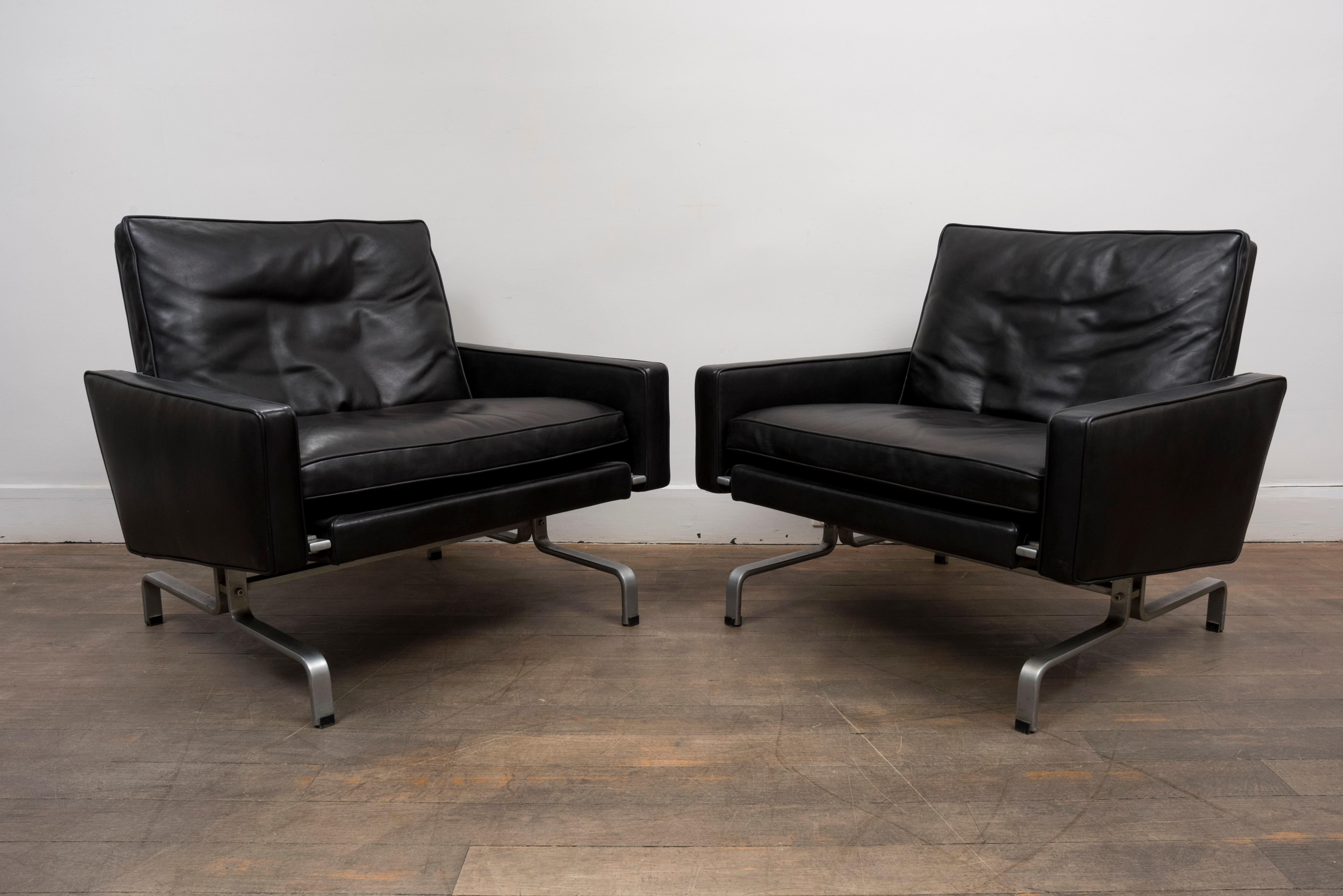 A pair of black leather lounge chairs
Model PK31/1
Design : Poul Kjærholm, 1958
Manufactured by E. Kold Christensen
Marked on metal foot
upholstered in black calfskin . 
Denmark, circa 1960.

Measures: Height 70 cm (27.6 in.)
Width 77 cm (30,32