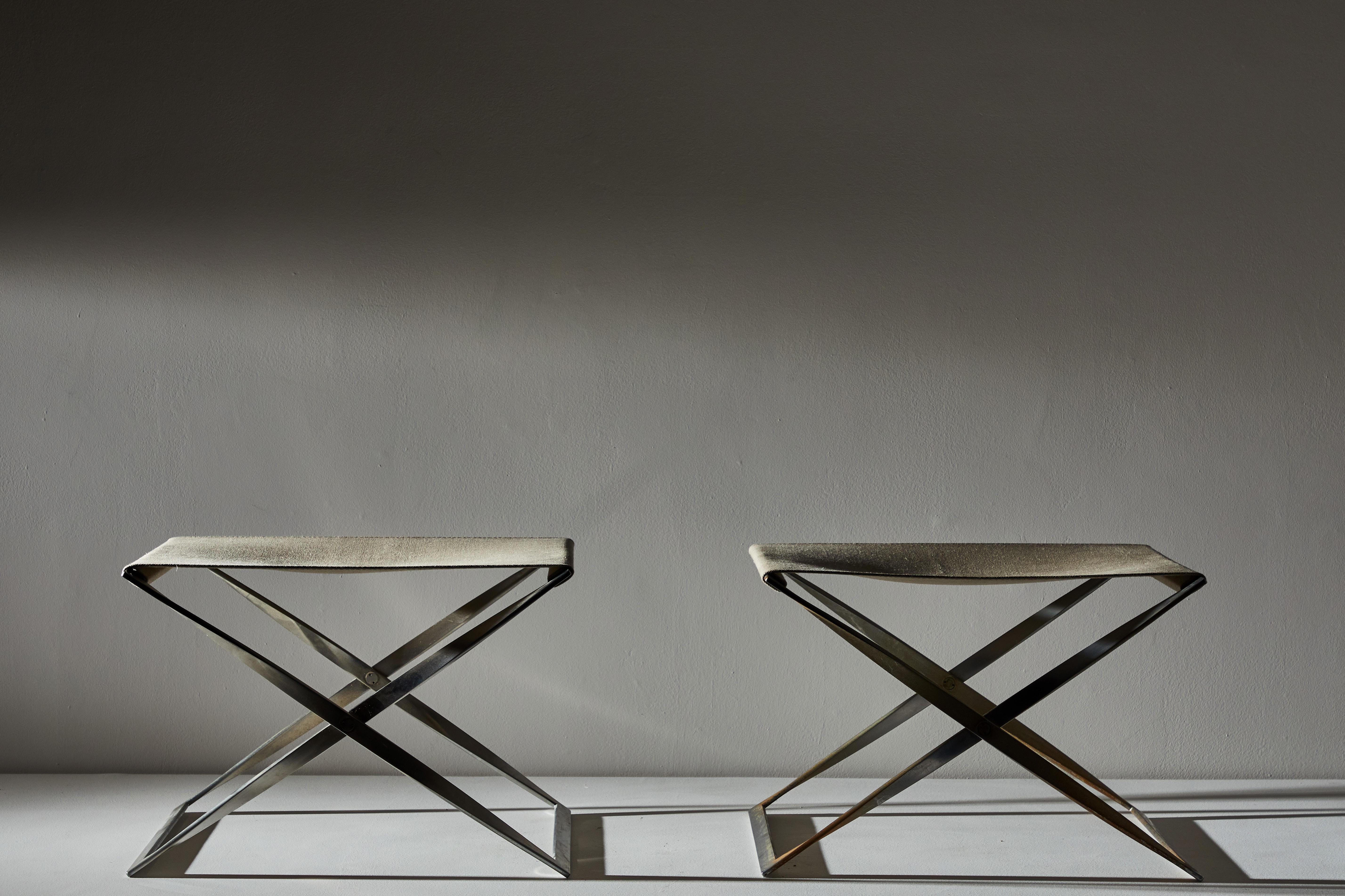 Pair of PK91 folding stools by Poul Kjærholm for E. Kold Christensen. Made in Denmark, circa 1961. 

Materials: canvas, matte chromed-plated steel frame. Canvas replacement slings by Fritz Hansen.

Literature: The Furniture of Poul Kjaerholm: