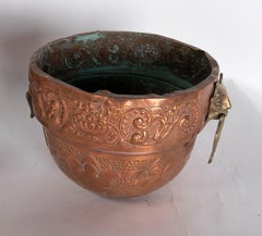 Pair of Planters in Iron, Embossed Metal and Bronze with Faces on Sides