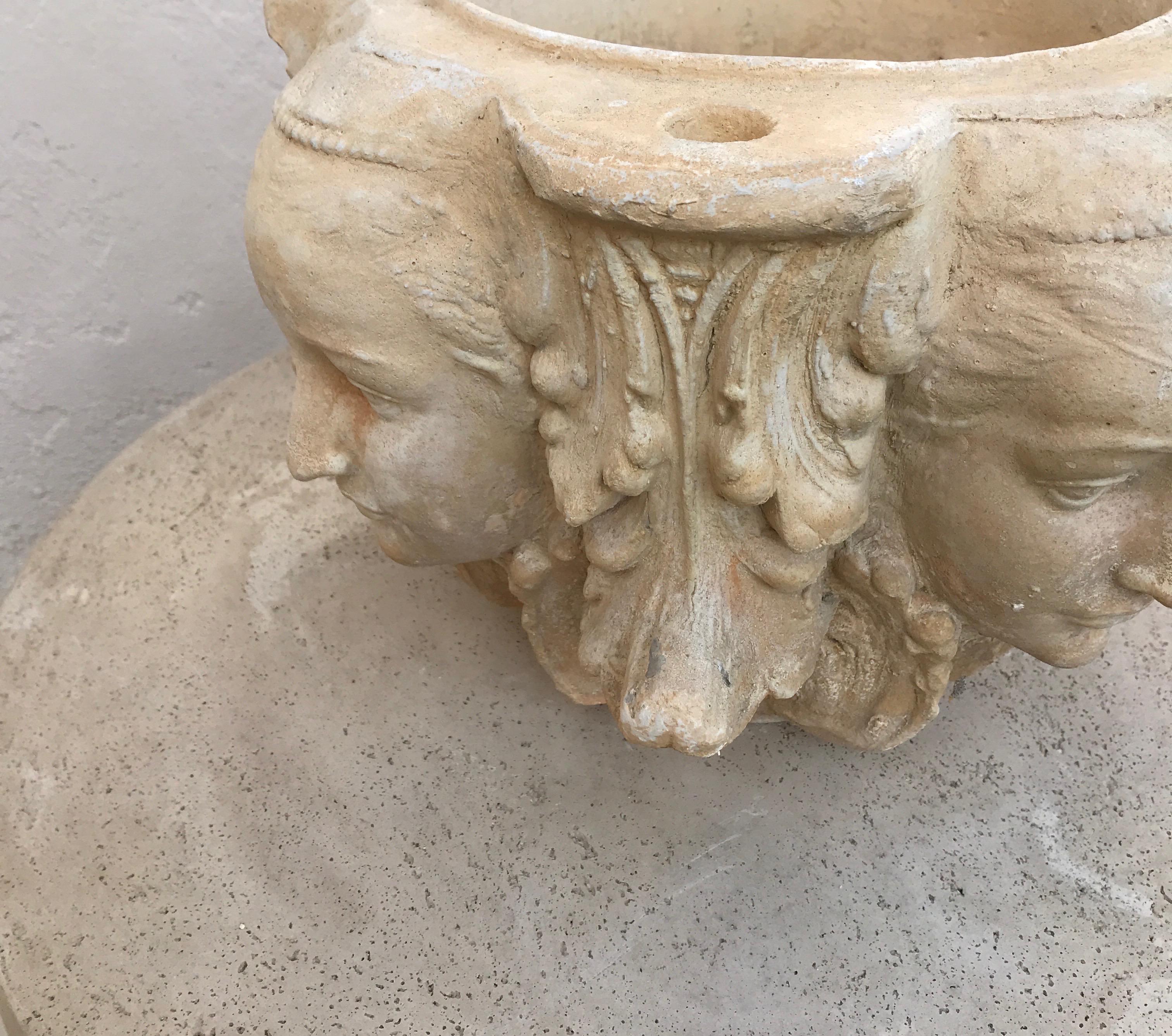 Pair of Planters with Four Candle Holes and Faces on Each Side 1