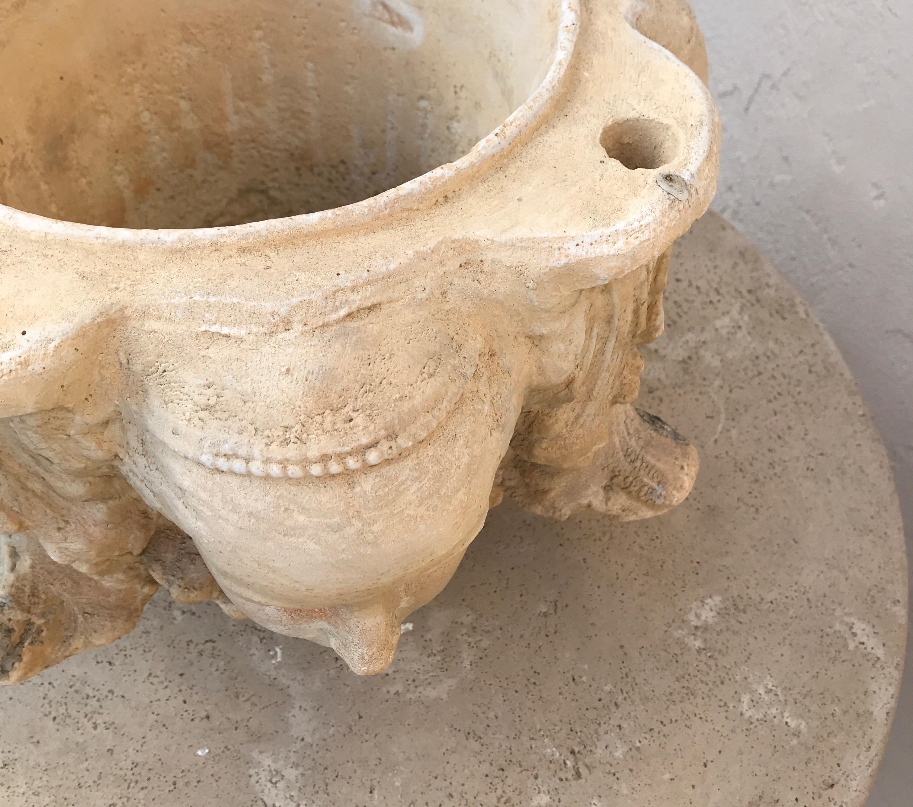 Pair of Planters with Four Candle Holes and Faces on Each Side 2