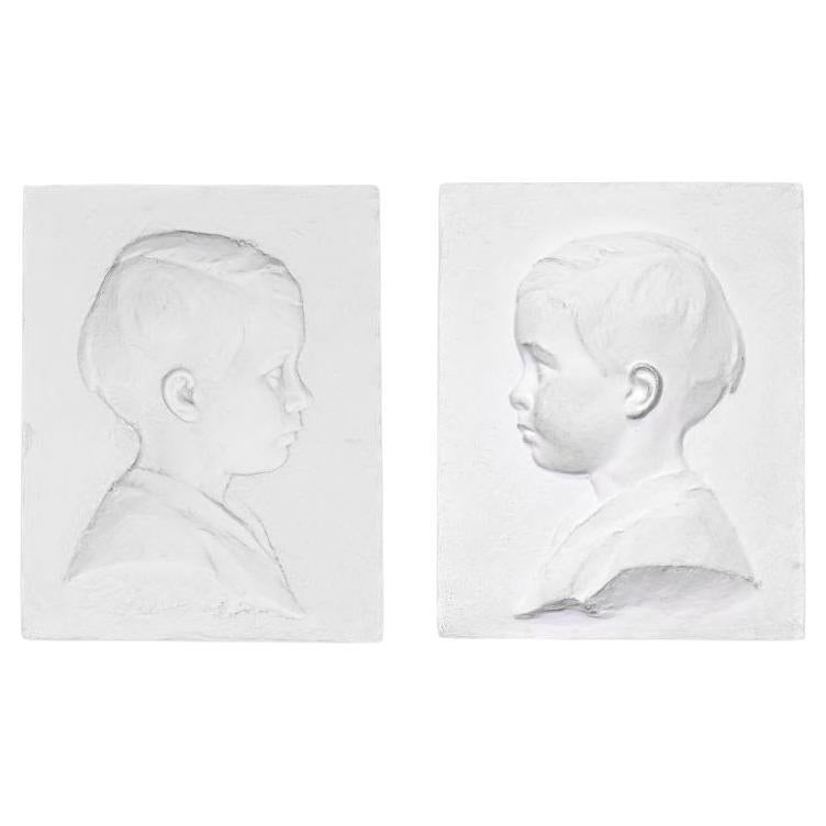 Pair of Plaster Child's Profile, 20th Century.