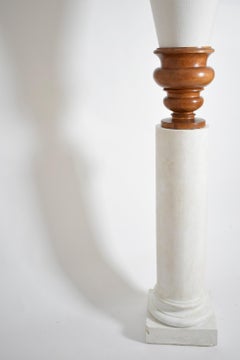 Pair of plaster columns and wooden lamps vases.