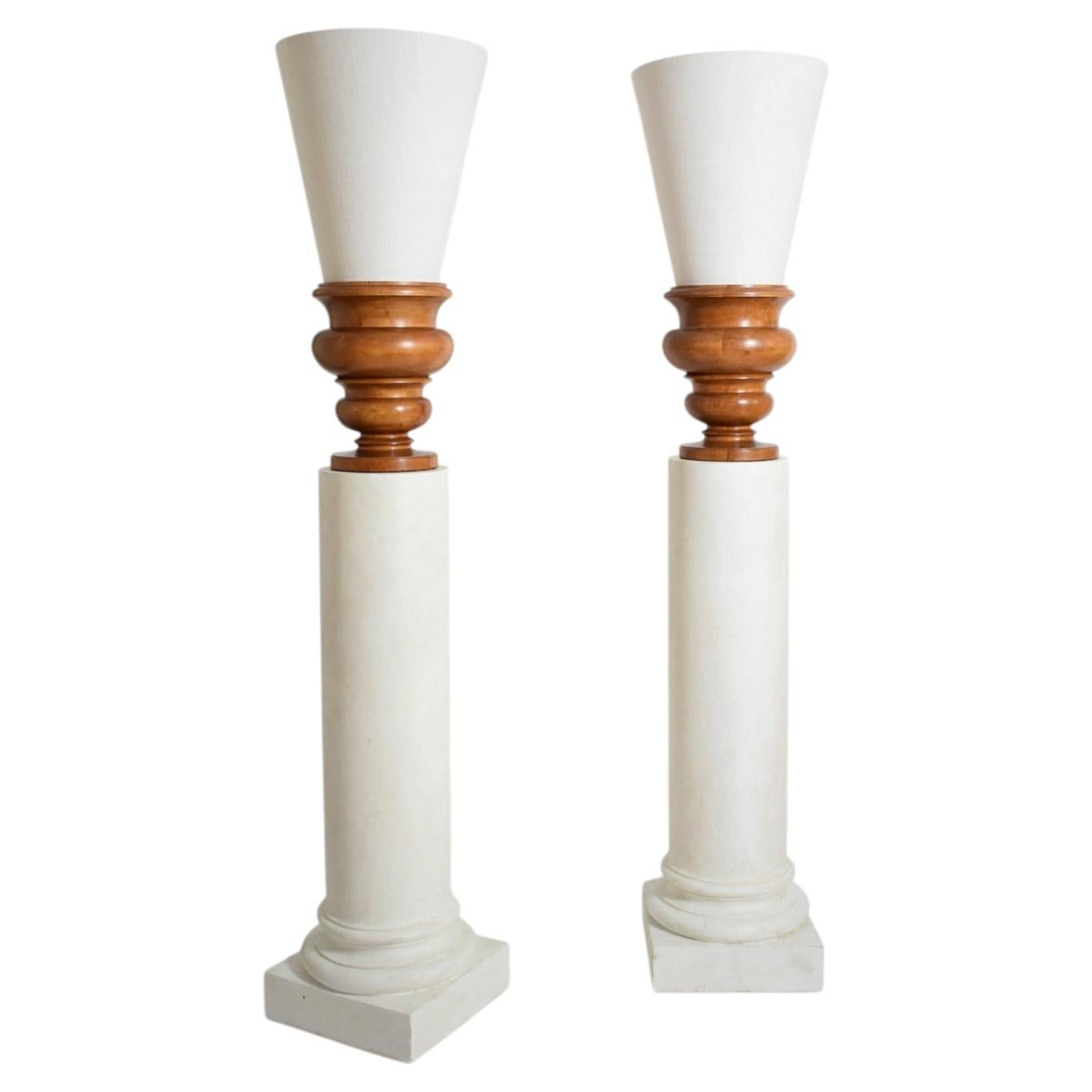 Pair of plaster columns and wooden lamps vases.