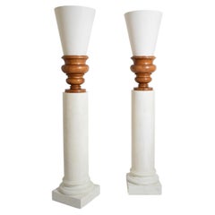 Pair of plaster columns and wooden lamps vases.