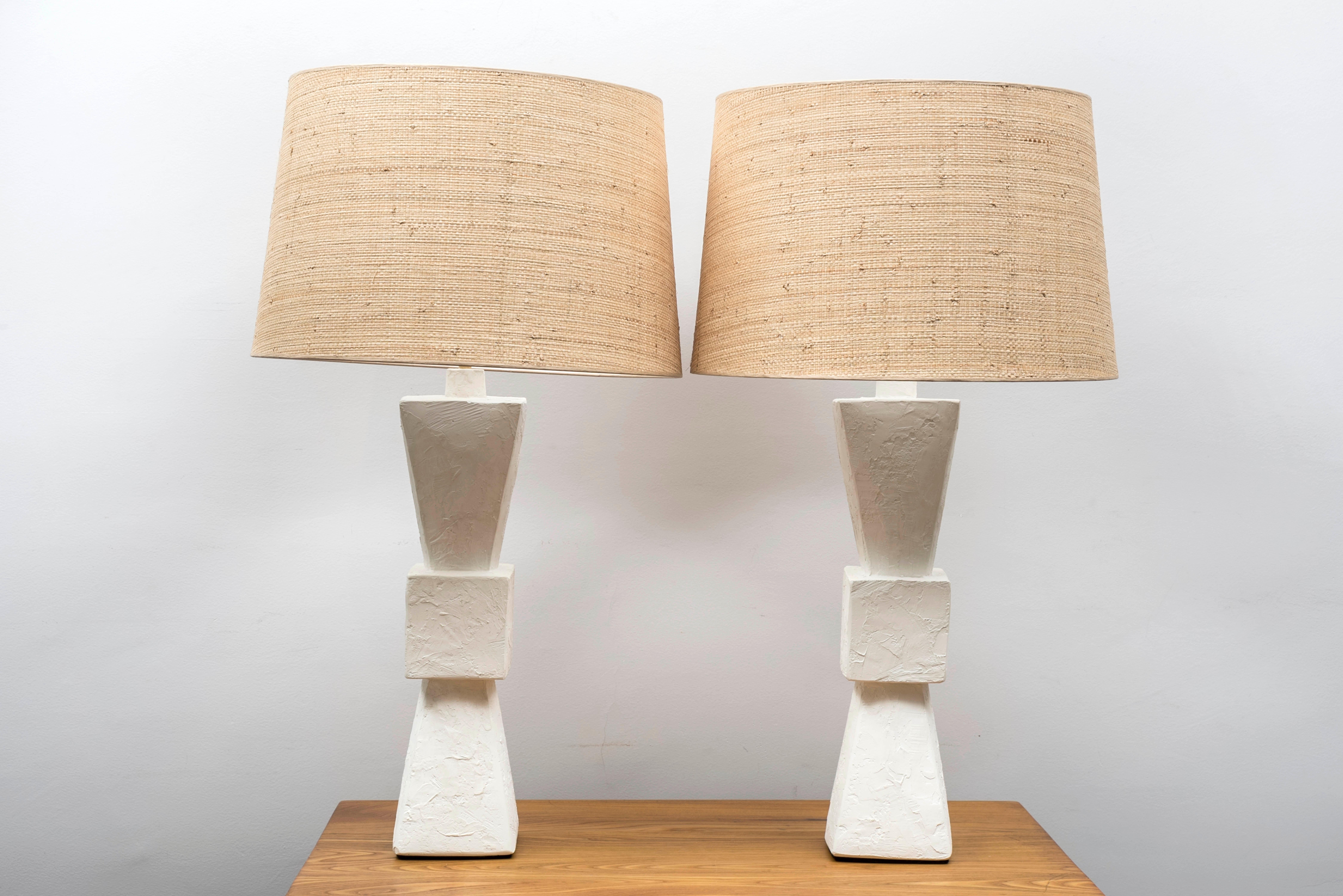 Pair of plaster lamps, baluster shape.
With costumed made shades in vegetal fiber.
France, contemporary creation

Measures: Total height 81 cm - 31.9 inches
Plaster base heigh (including collar) 52 cm - 20.5 inches
Diameter (shade) 47 cm -