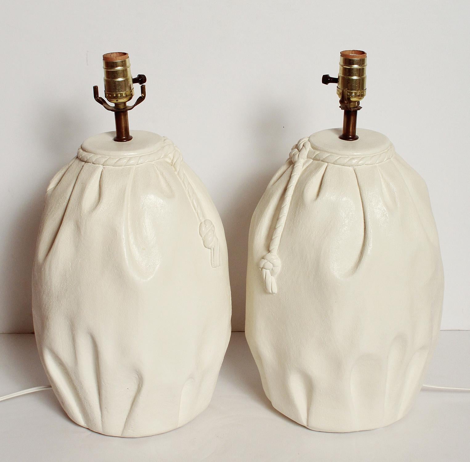 Unusual pair of 1980s plaster lamps in the style of John Dickinson.
Made to look like a cloth sack with rope.

Very unique.
 