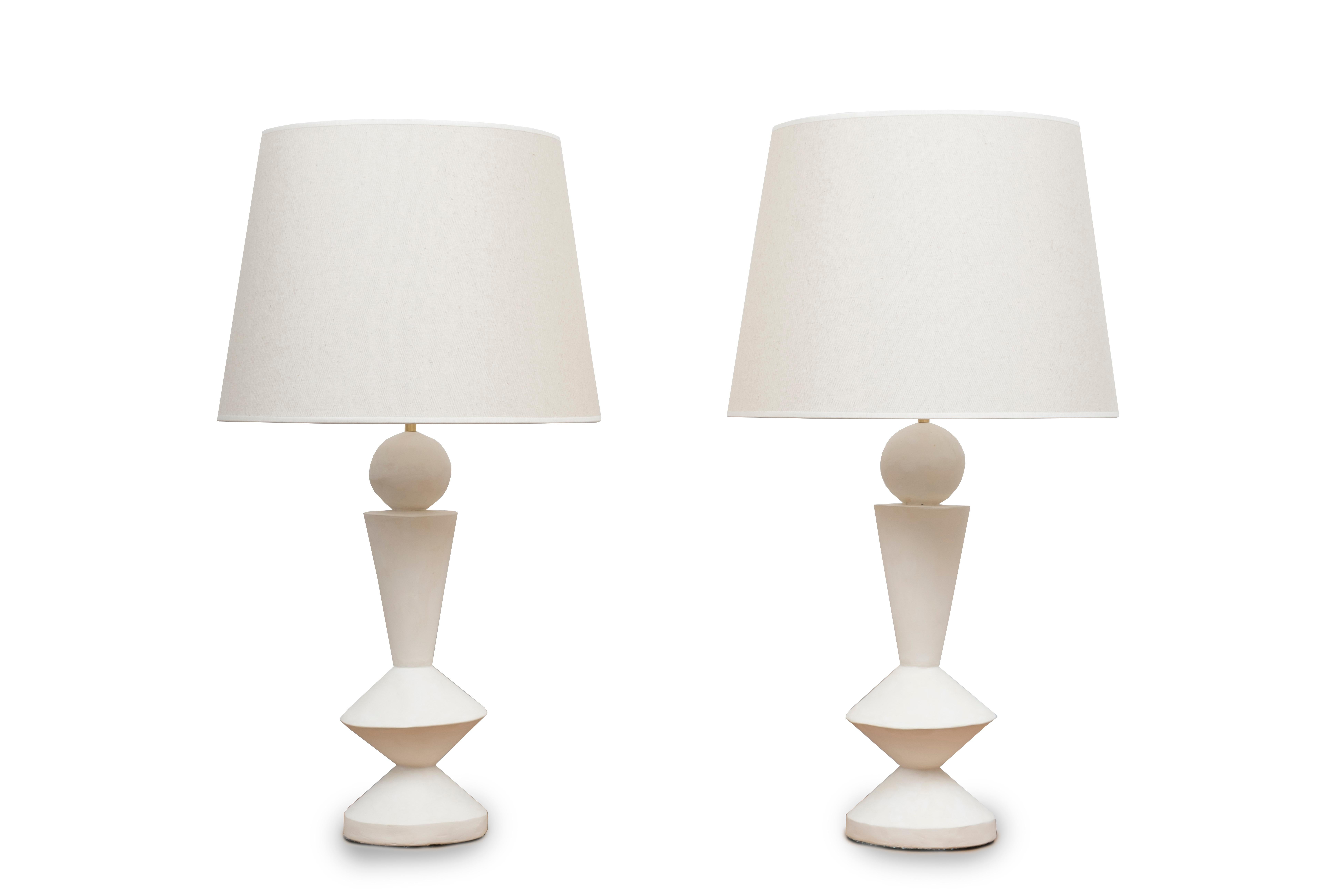 Pair of stuccoed plaster lamps
Custom made shades
Inspired by Jean-Michel Frank
France, modern production

Measures: Height total 84 cm ( 33 inches) 
Height plaster foot 47 cm ( 18.5 inches) 
Diameter (shade) 45 cm ( 17.7 inches) 
