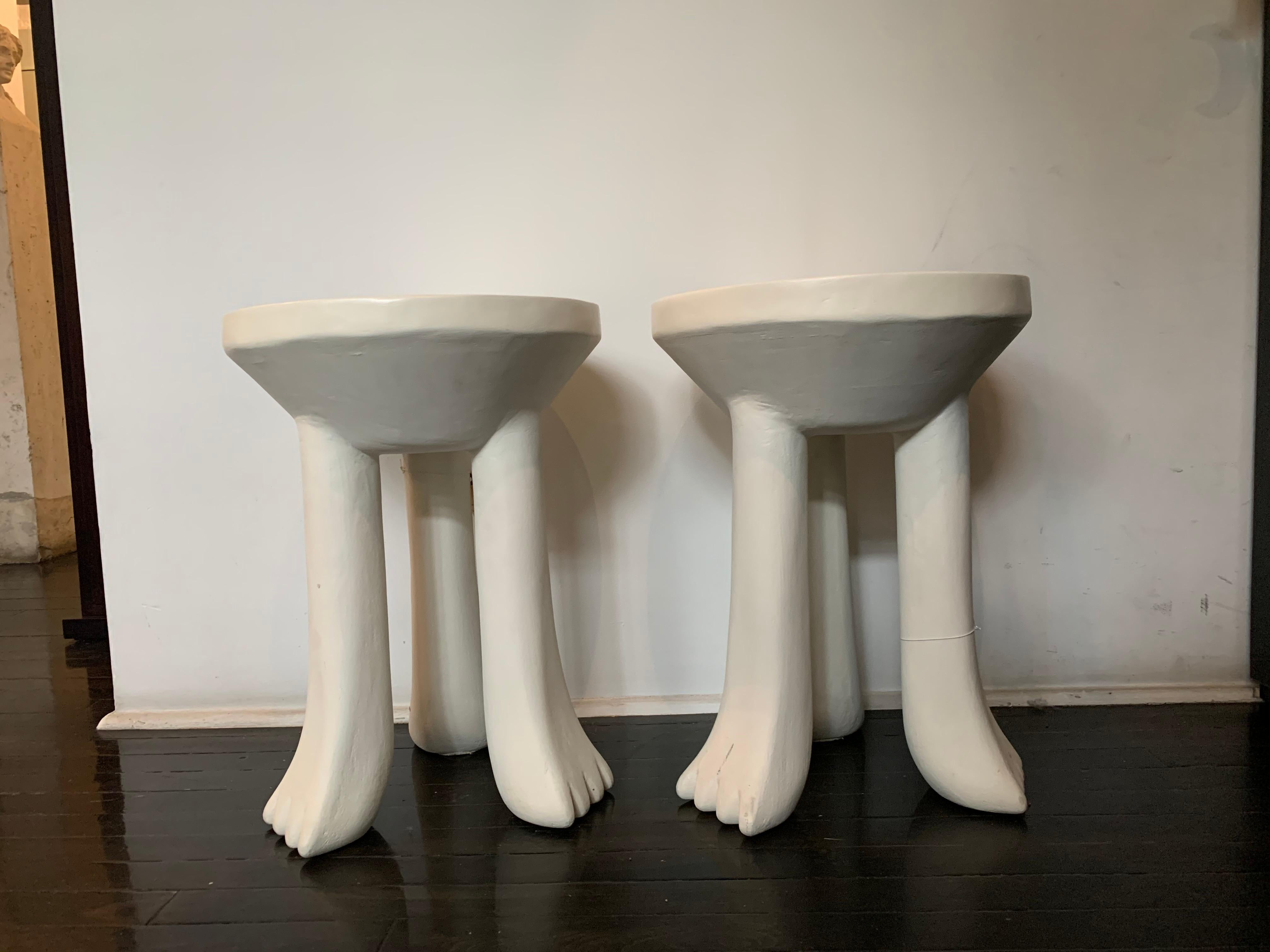 A pair of three-legged painted plaster side tables.

Property from esteemed interior designer Juan Montoya. Juan Montoya is one of the most acclaimed and prolific interior designers in the world today. Juan Montoya was born and spent his early