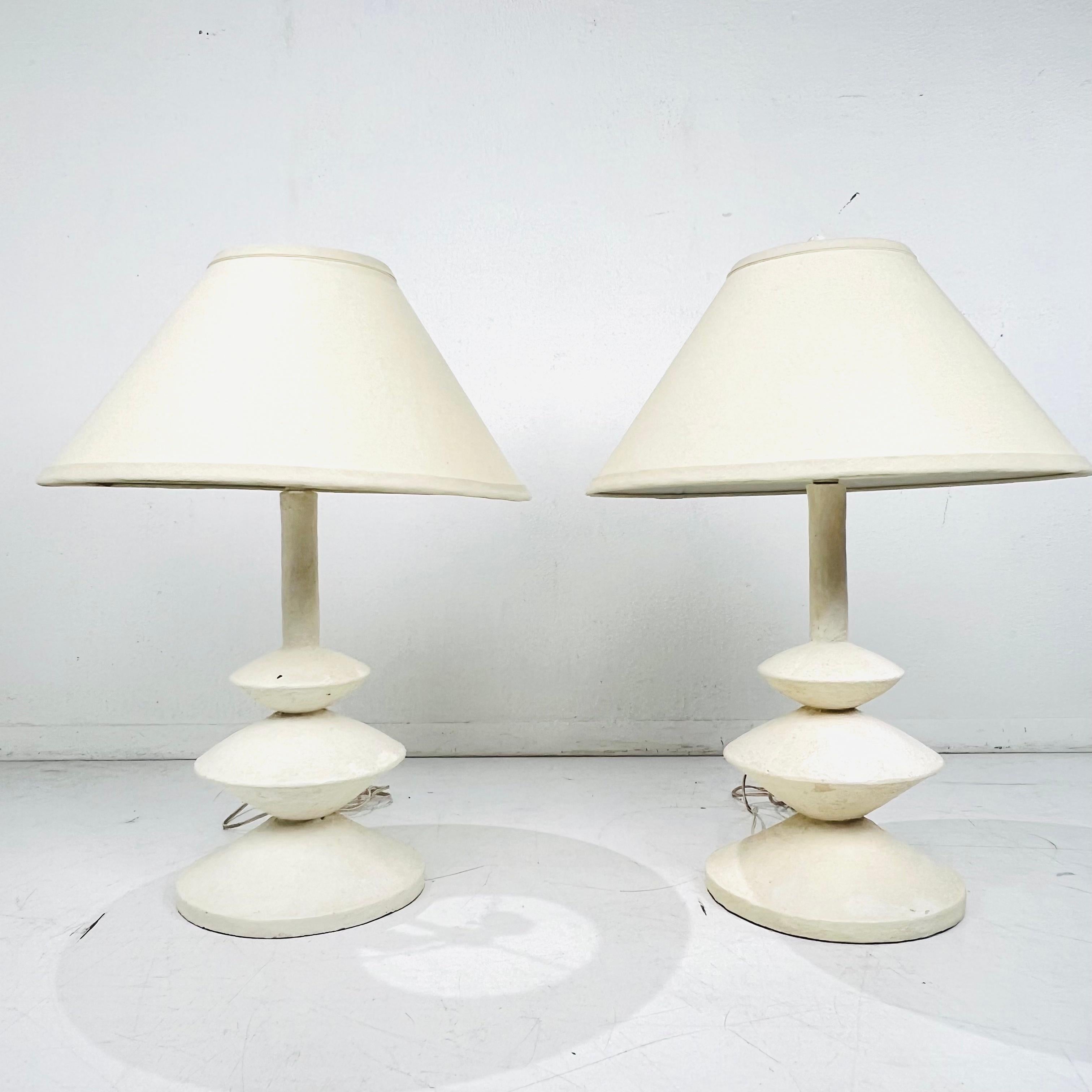 Elegant Pair of French style table lamps in the style of Alberto and Diego Giacometti. These lamps have a timeless columnar, cylindrical organic form that has an enchanting sensibility. Priced and sold as a pair. Shades are not included. Sturdy and