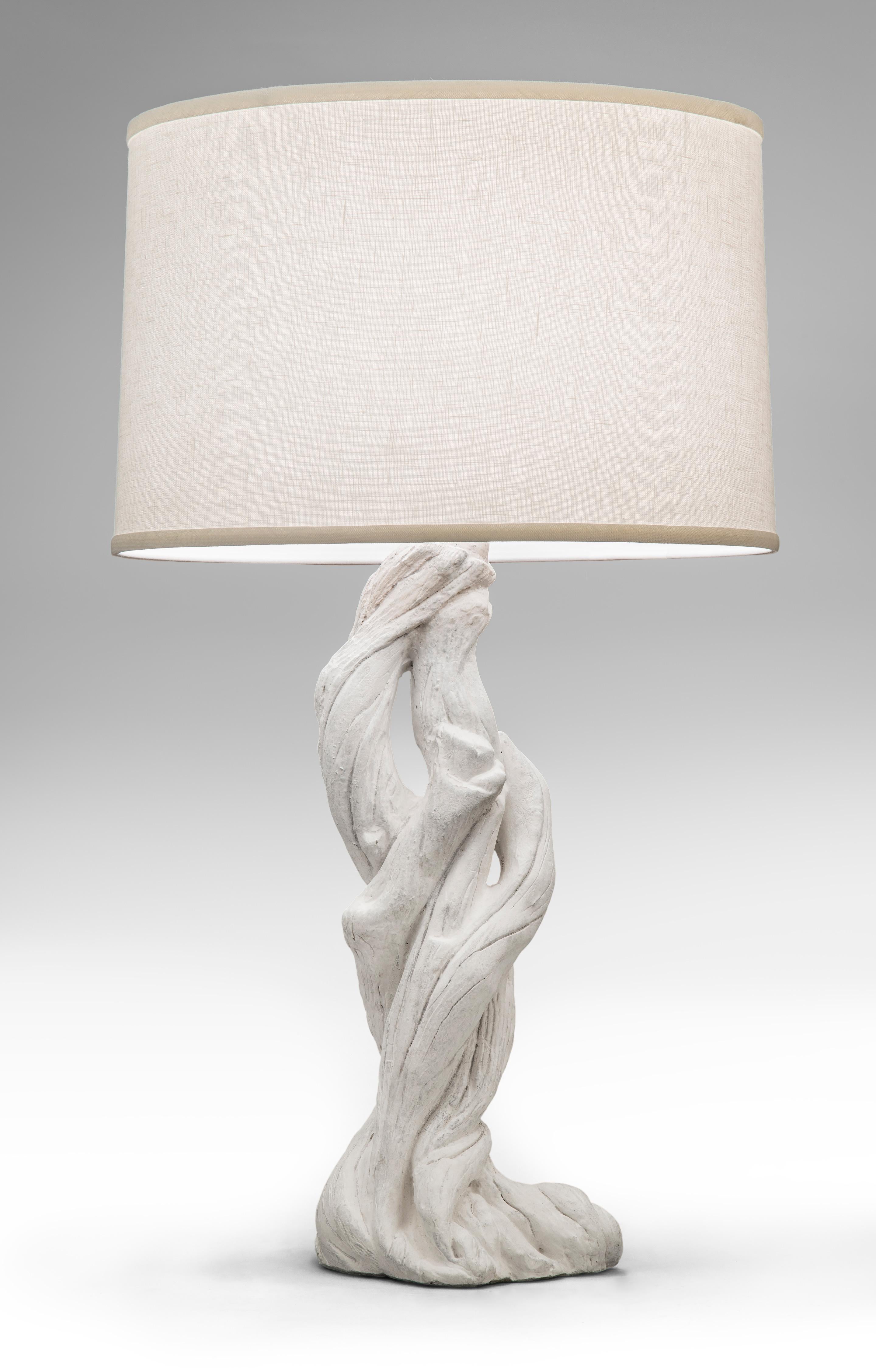 A pair of plaster tree lamps in the style of Serge Roche,
mid-20th century.
These striking lamps bring to mind the genius of Serge Roche designs. Of natural form, the base a series of entwined branches rising to a pinnacle.
Measure: Height to