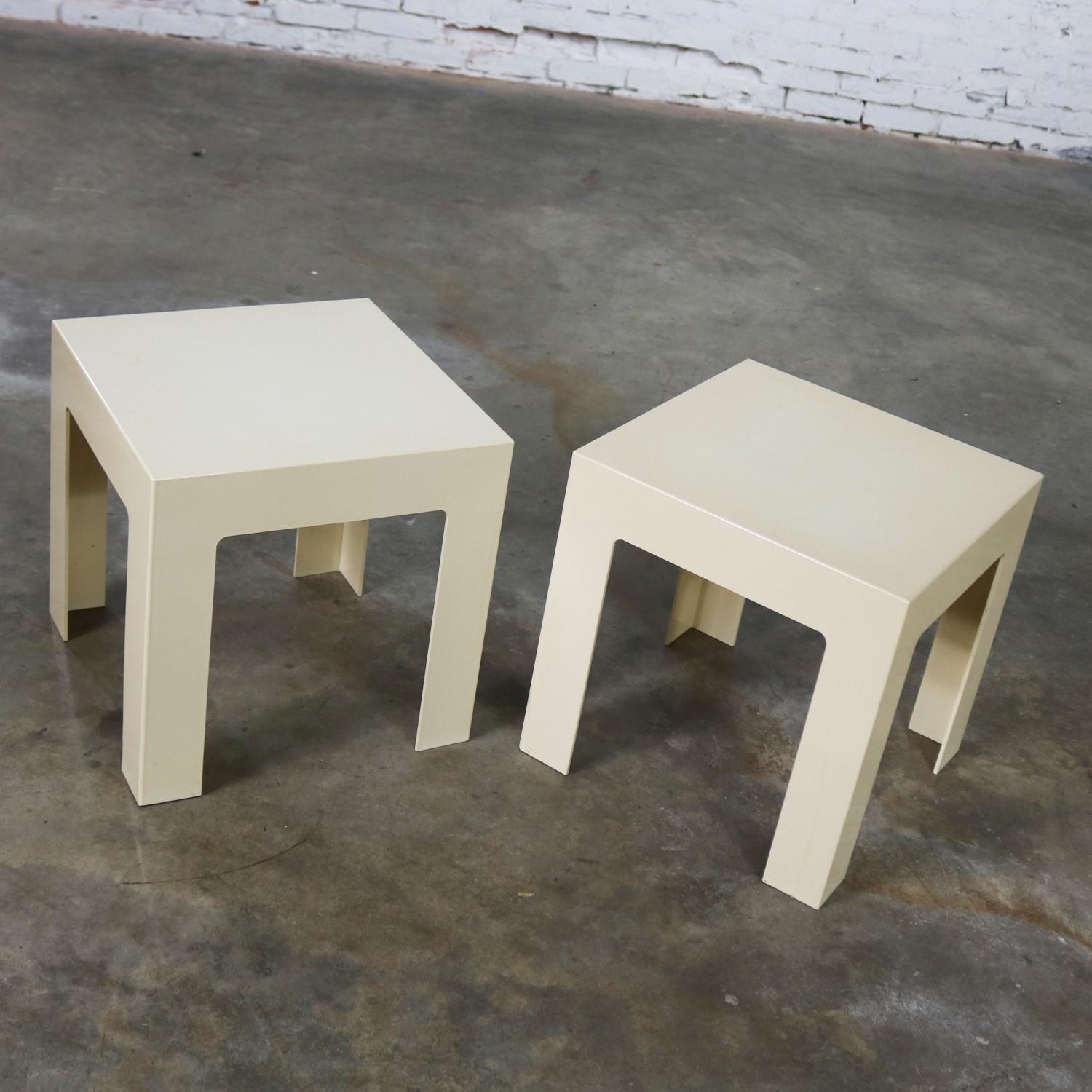 Wonderful pair of heavy plastic parsons square side tables. They are both antique white but just a shade different. Done in the style of Kartell or Syroco although unsigned. They are in fabulous vintage condition with normal wear and tear but no
