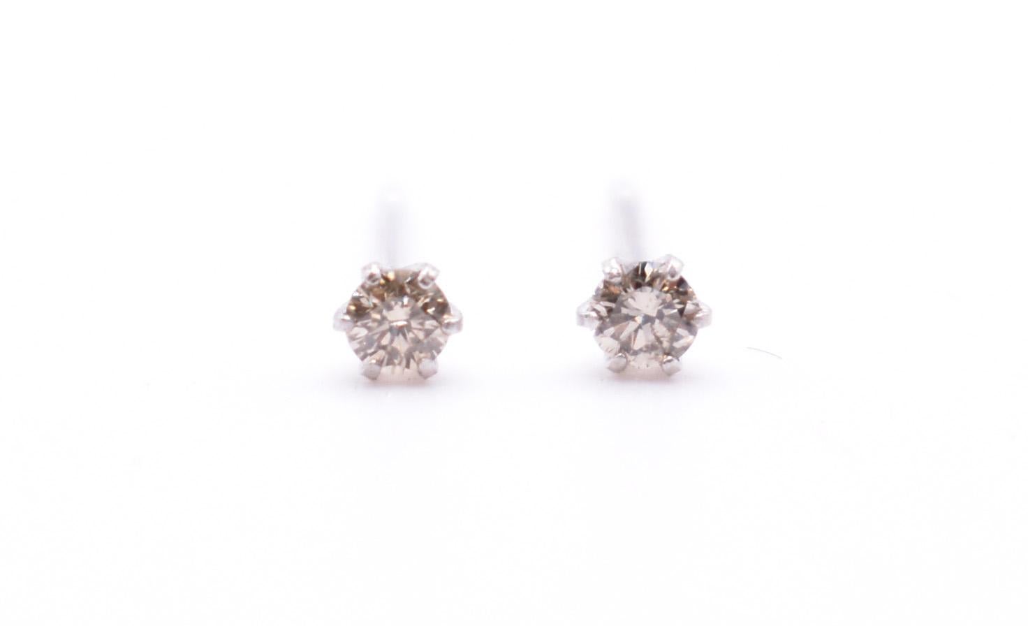 Round Cut Pair of Platinum Diamond Stud Earrings For Sale