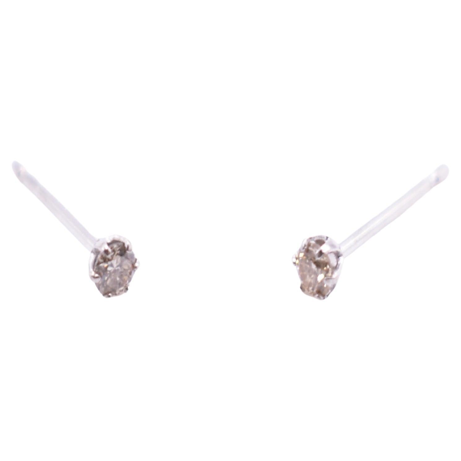 Pair of Platinum Diamond Stud Earrings For Sale
