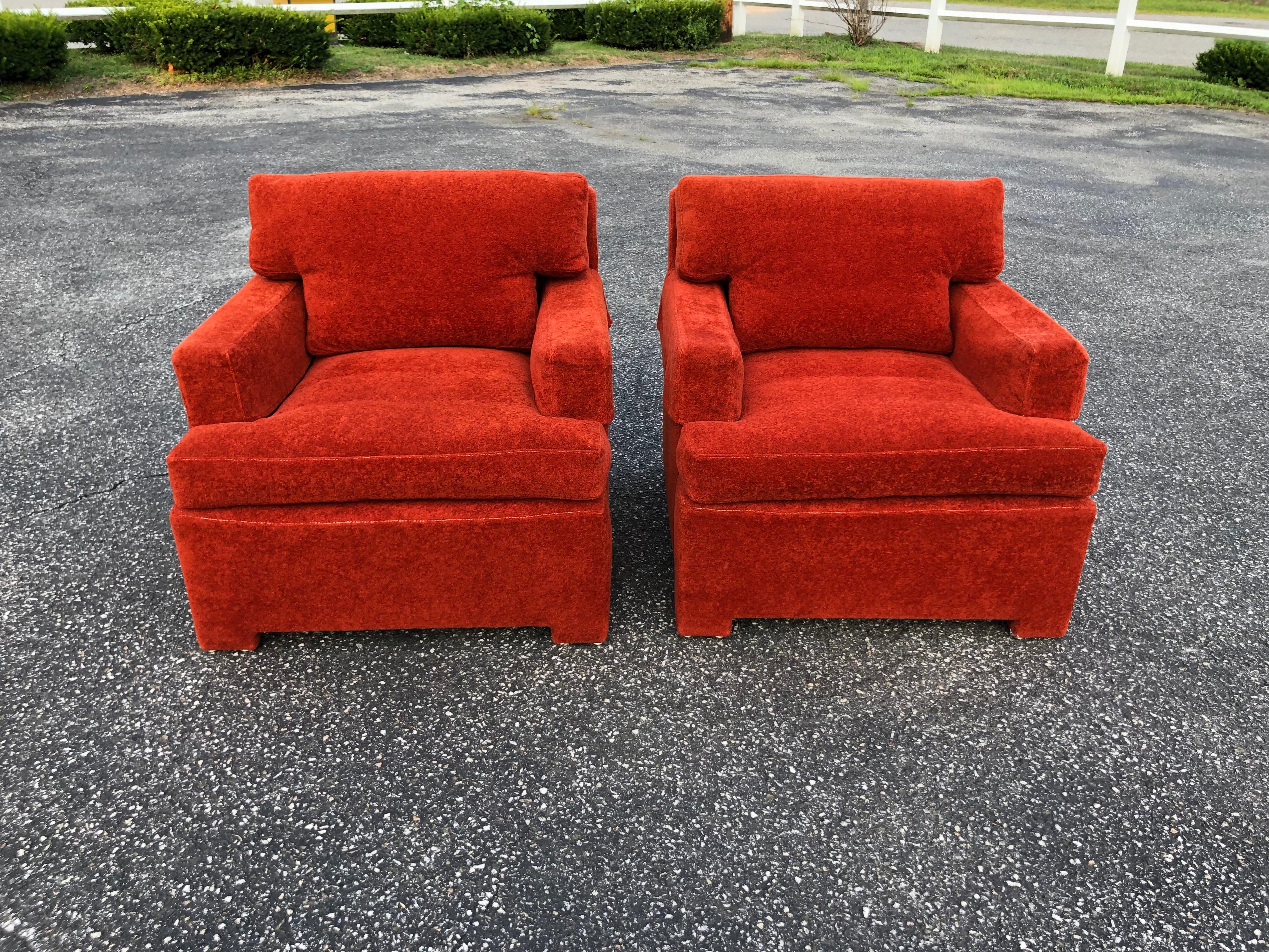 Pair of Plush Edward Wormley Dunbar lounge chairs in orange rust mohair like upholstery . Sink into these amazing chairs and relax. Great for a bedroom, living room or office/study. We think these are possibly covered in Mohair but are not fabric