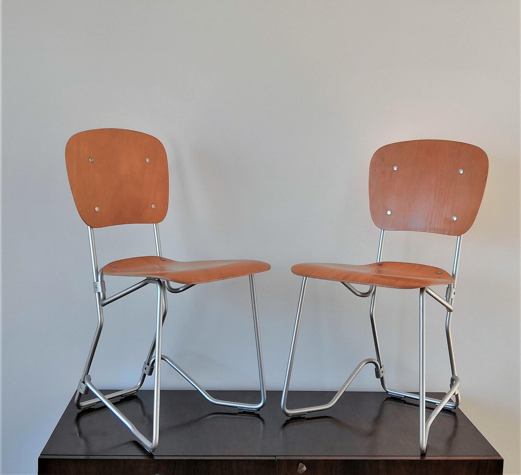 Swiss Pair of Elm Plywood and Aluminum Stackable Chairs by Armin Wirth, 1950s