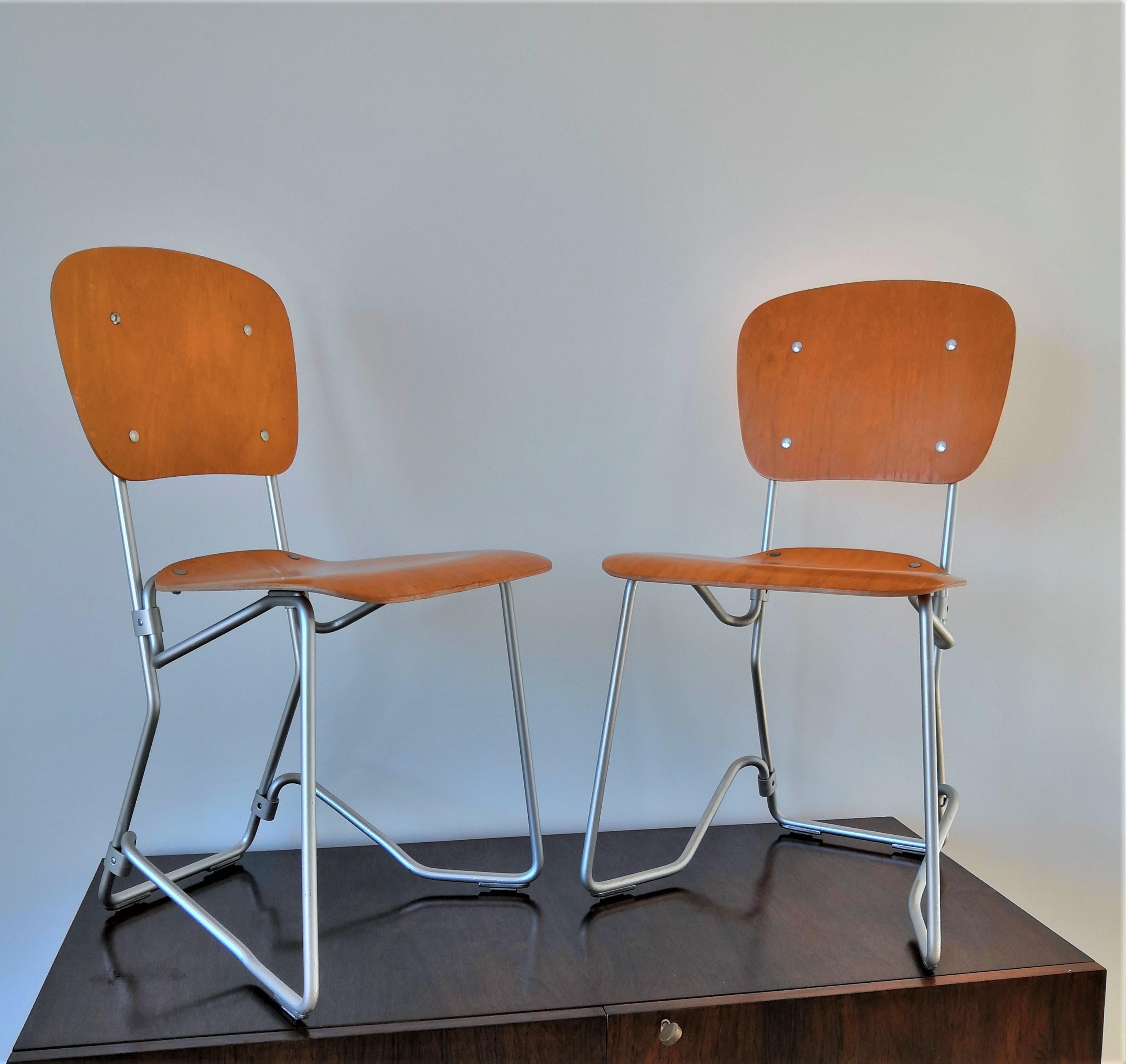 Pair of Elm Plywood and Aluminum Stackable Chairs by Armin Wirth, 1950s In Good Condition In New York, NY