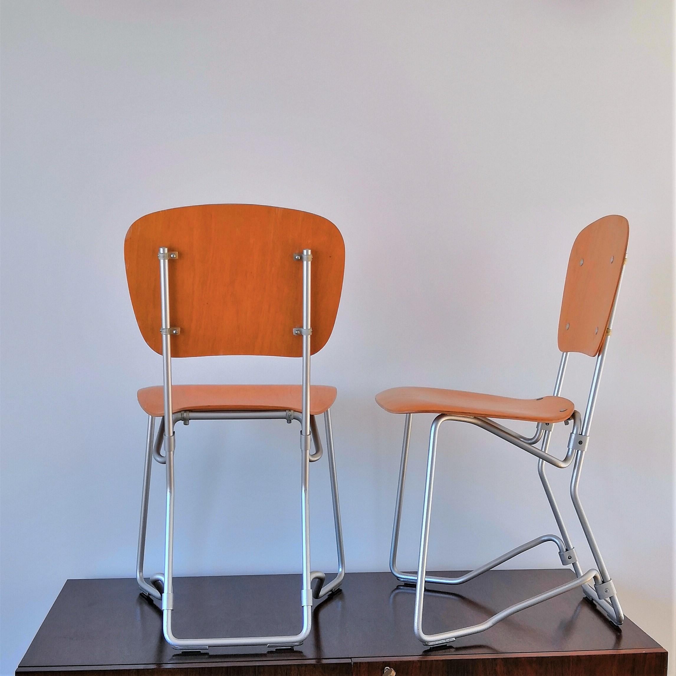 Pair of Elm Plywood and Aluminum Stackable Chairs by Armin Wirth, 1950s 1