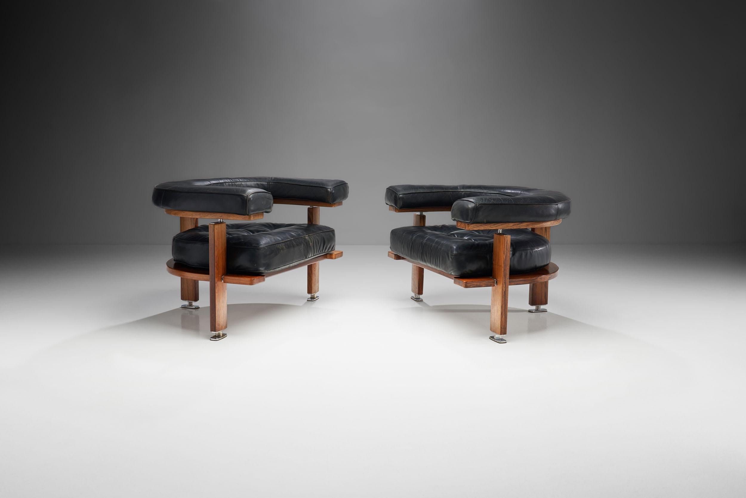 This pair of “Polar” lounge chairs was designed by the eminent Finnish designer, Esko Pajamies, and produced by Lahden Lepokalusto Oy Finland during the 1960s.

These leather chairs feature a half moon shaped backrest and comfortable,
