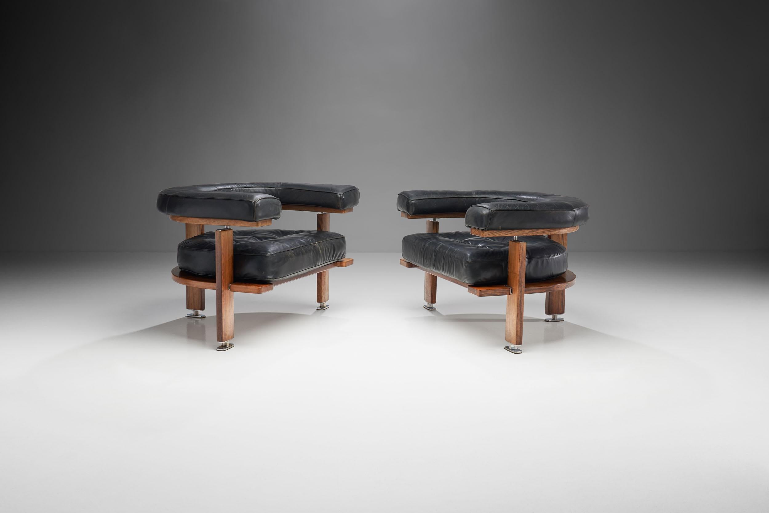 This pair of “Polar” lounge chairs was designed by the eminent Finnish designer, Esko Pajamies, and produced by Lahden Lepokalusto Oy Finland during the 1960s.

These leather chairs feature a half moon shaped backrest and comfortable, aesthetically