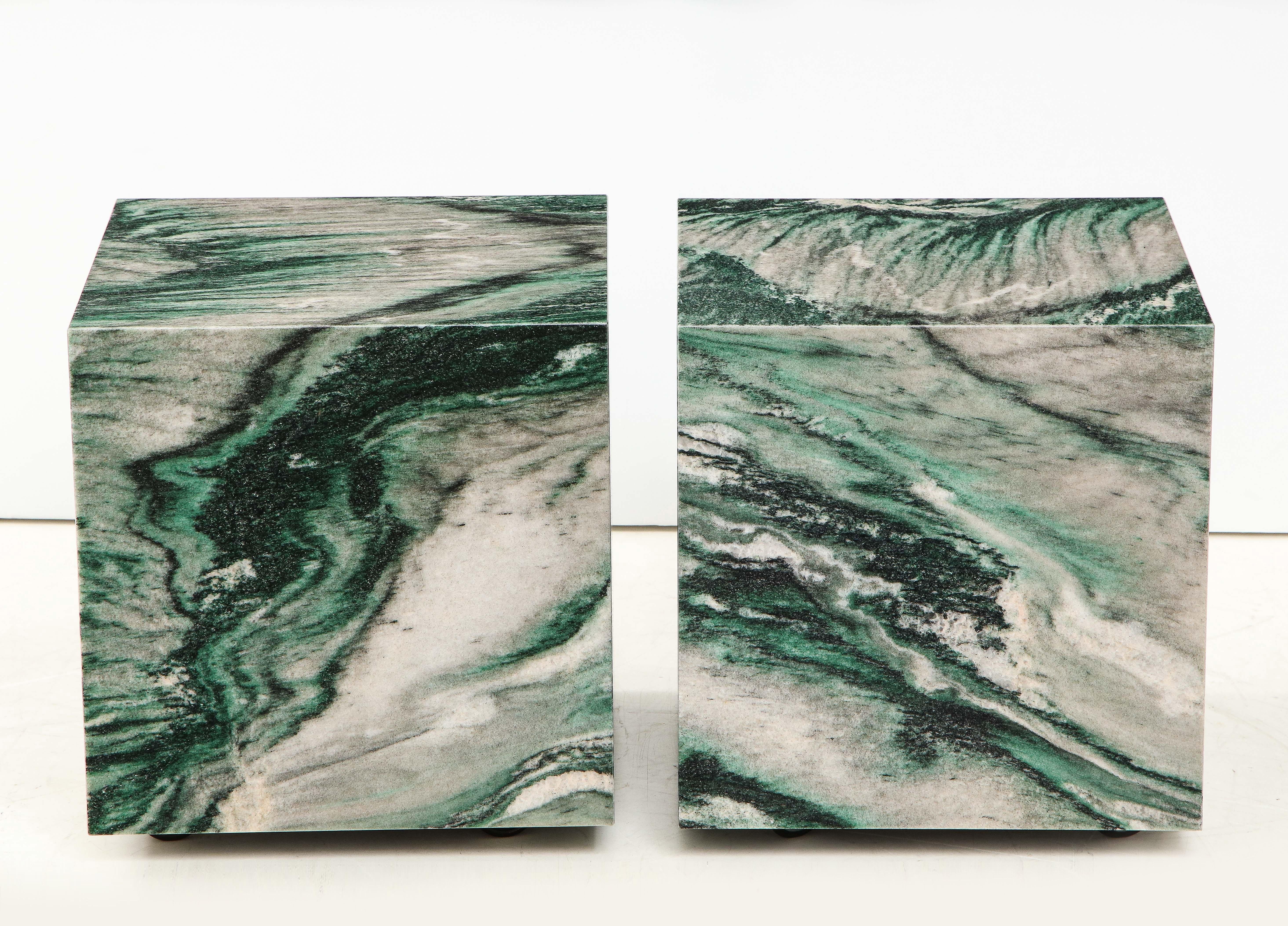 Stunning pair of Polar Verde marble cubes.
The matched marble makes for a beautiful pair of end tables that are easily
moveable as they are on polished chrome casters.