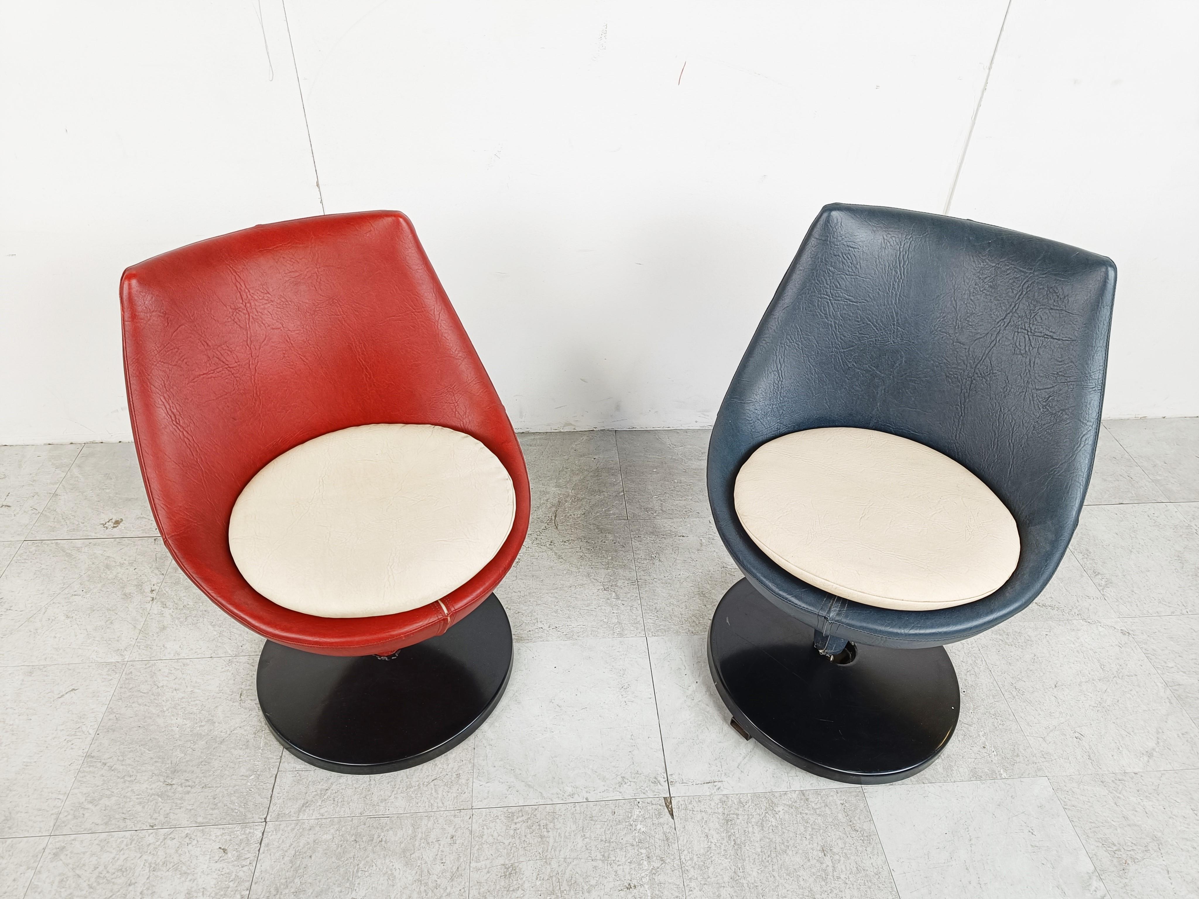 Pair of midcentury swivel chairs model 'Polaris' designed by Pierre Guariche for Meurop.

The chairs have a metal base with the intact original plastic cover and a with leatherette upholstered shell.

Good condition.

Beautiful timeless