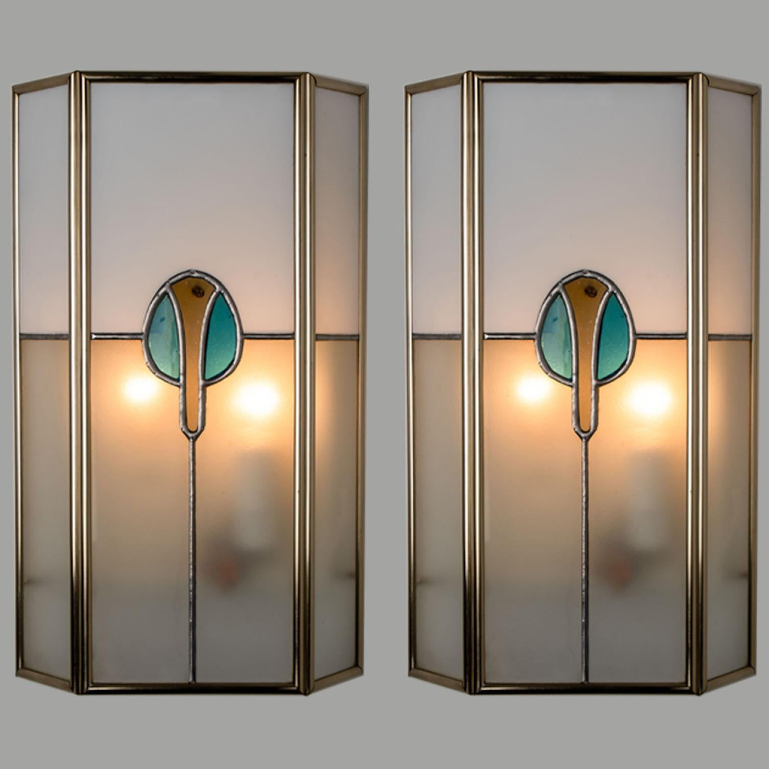 A pair of  Frosted stained wall lights. Manufactured by PoliArte, Italy in the 1970s.

Albano Poli founded Poliarte in 1968 as an innovative and experimental lighting company.

His typical style was combining stainless steel or raw metal to modular