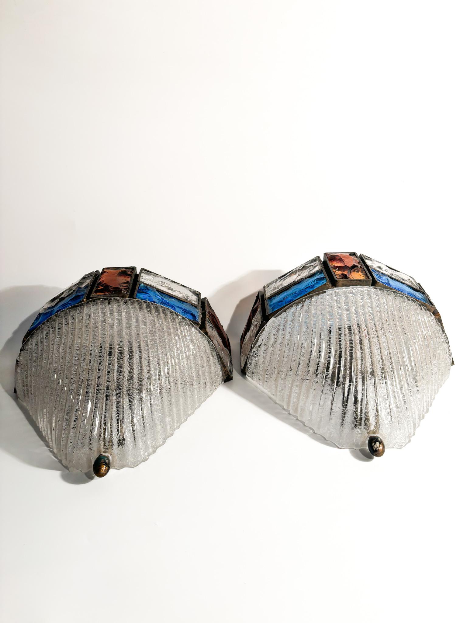 Pair of wall lamps in hammered glass and wrought iron, made by Poliarte Longobard in the 1970s

Ø cm 22 Ø cm 13 h cm 26

Poliarte and Longobard are two separate entities that collaborated on the creation of lighting fixtures, particularly during the