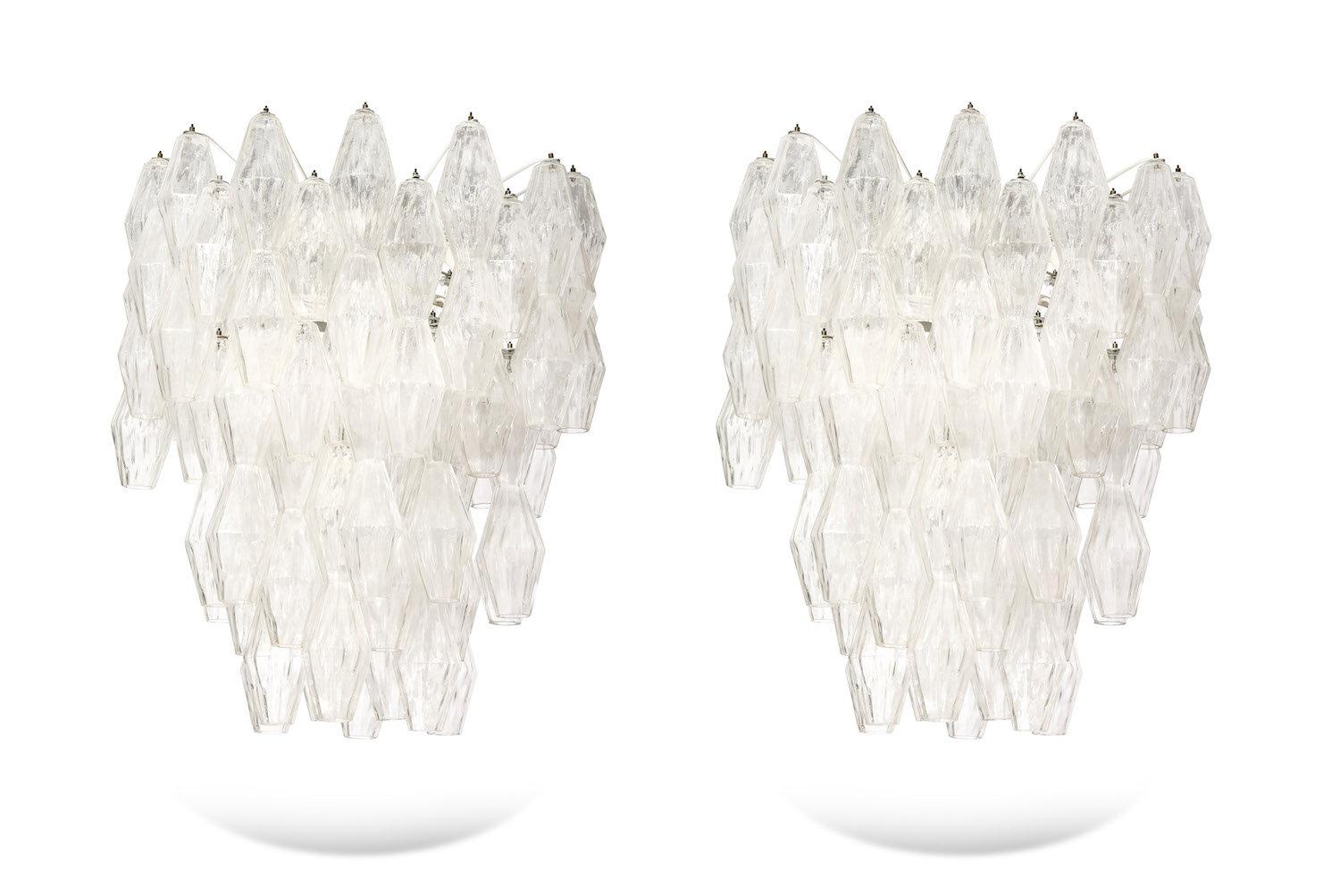 Designed by Paolo Venini and originally introduced in 1957. Beautiful and large fixture with textured blown glass. Abstract diamond forms with faceted sides hanging from multi-armed interior frame, with 14 candelabra sockets. Very elegant. Sold as a