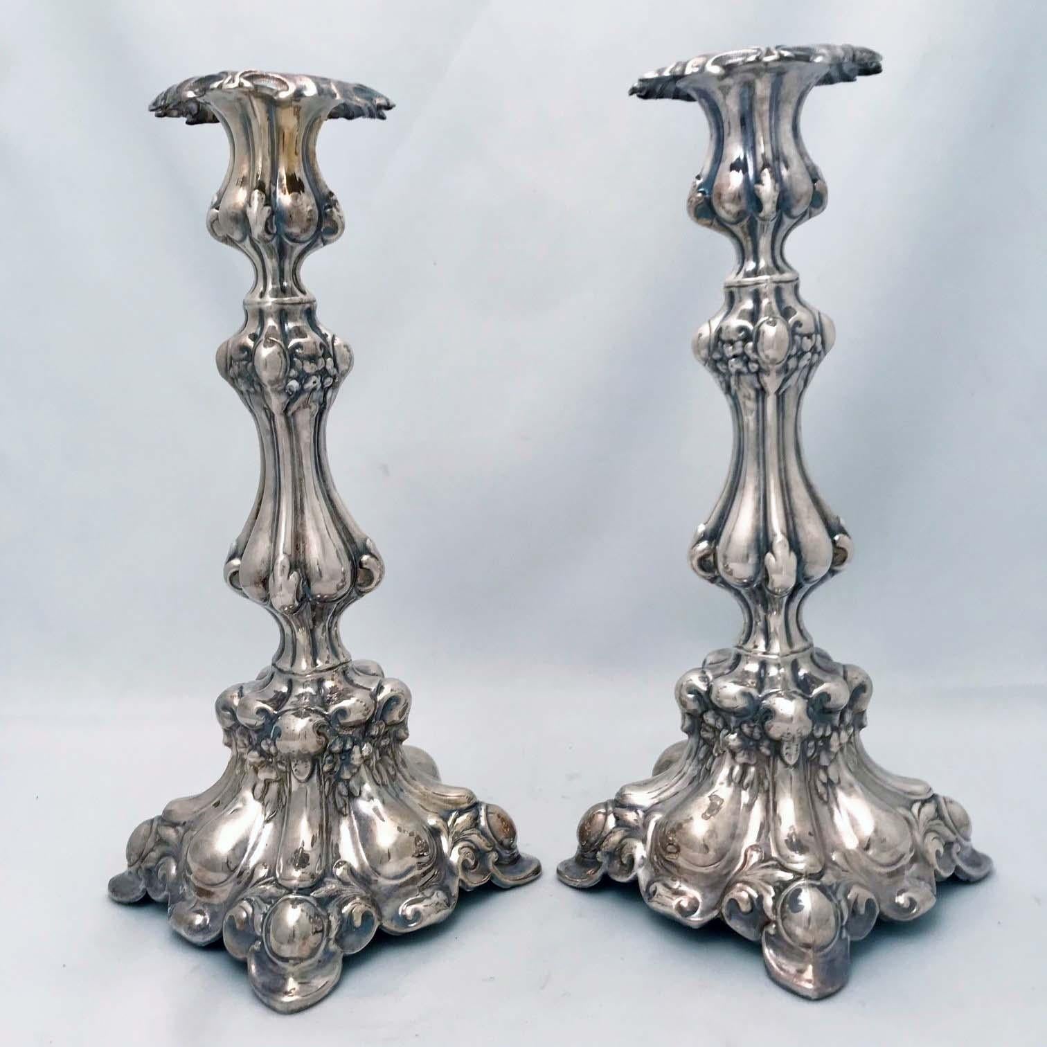These Polish candlesticks are in the Baroque taste, vigorously modelled and boldly conceived. They were originally Sabbath candlesticks but they might well be used  for secular purposes by gentiles too. The plate is in generally good condition. They