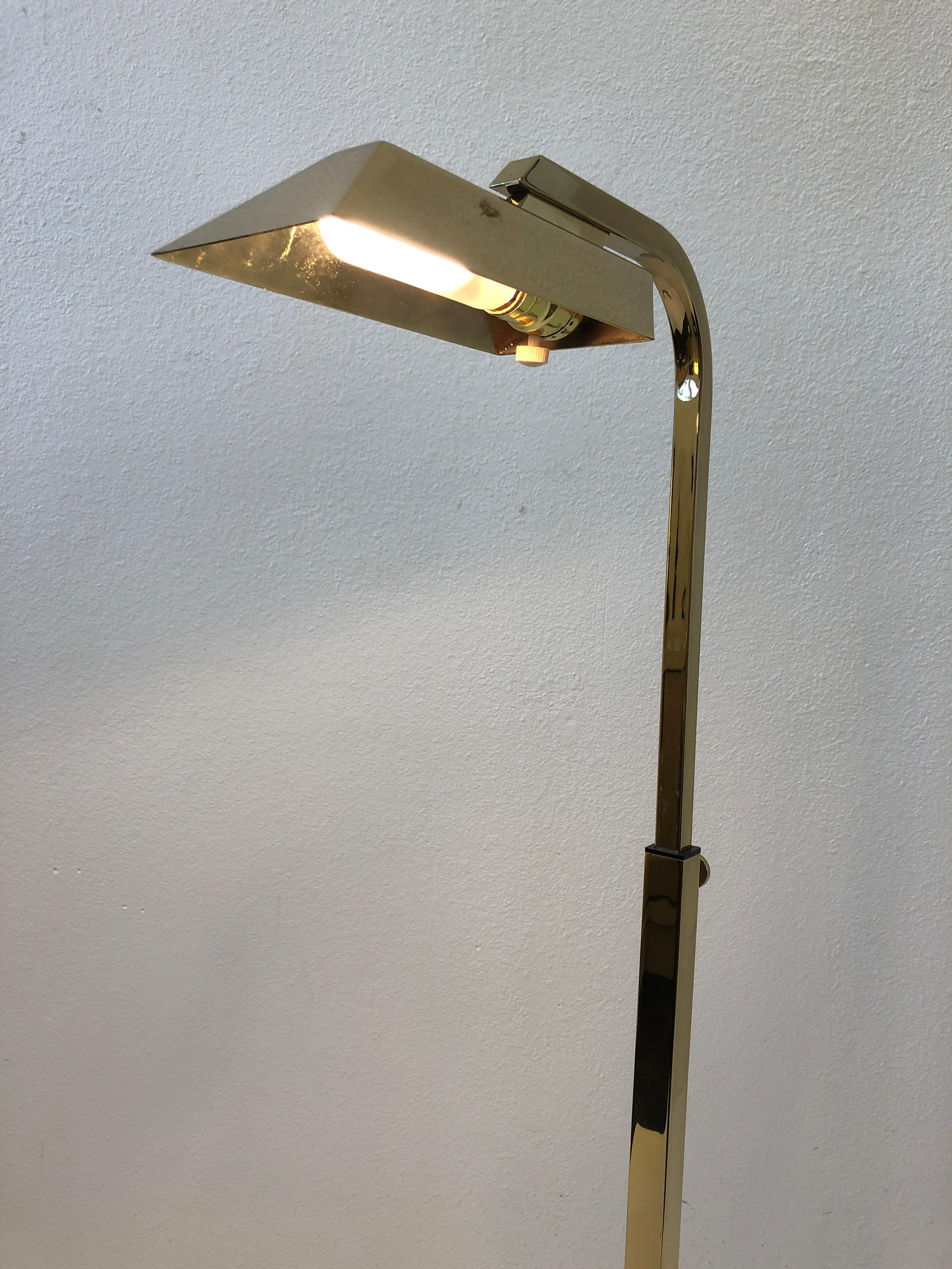 A glamorous pair of adjustable polish brass reading V-lamps designed by Charles Hollis Jones in the 1970. The lamps have been newly rewired. The lamps can bee adjusted up and down.
Overall dimensions: 17” wide, 17” deep, 45” high.