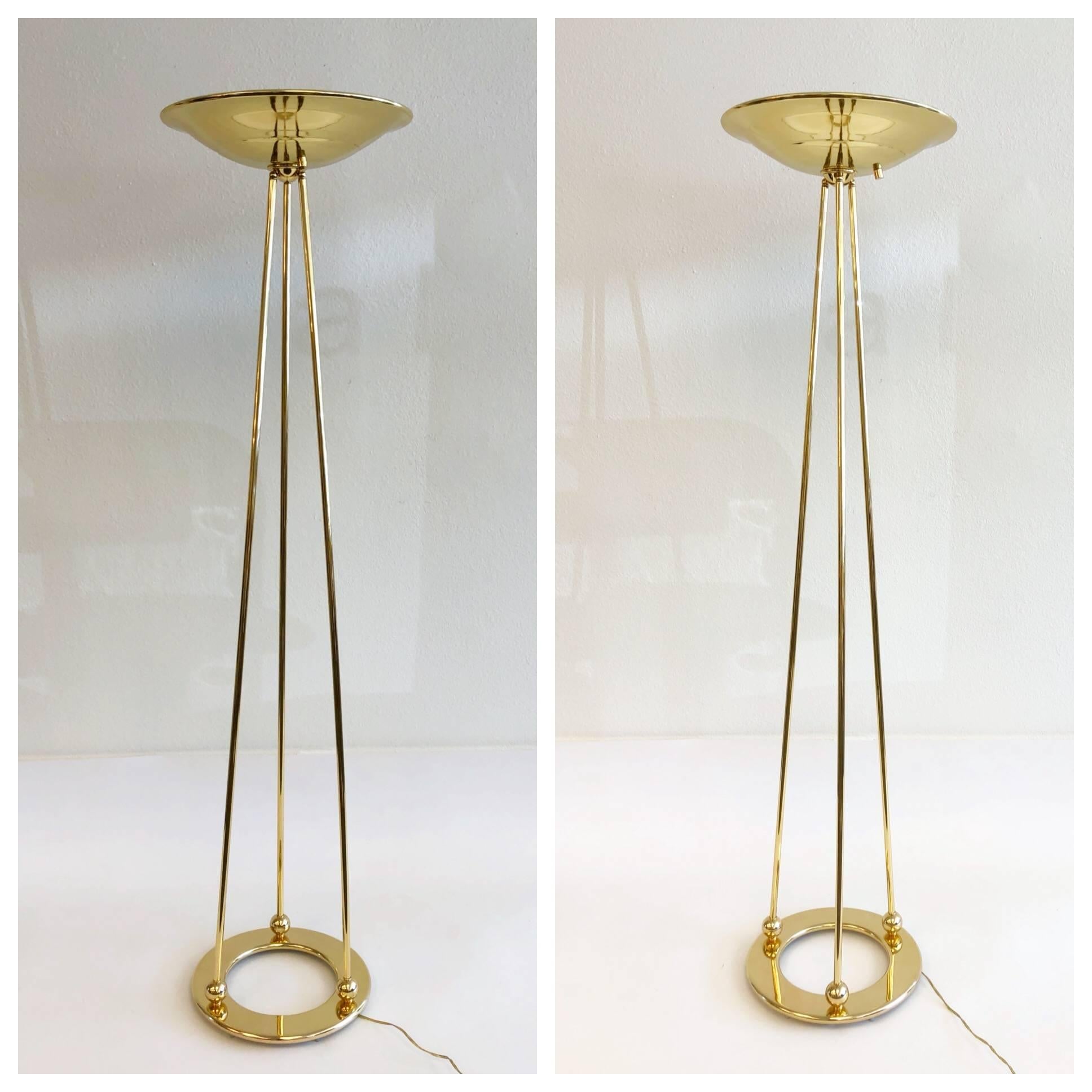 A beautiful pair of 1970s polish brass torchiere floor lamps by Casella.
The lamps have been newly rewired. The lamps have a full range dimmer on the shade and takes a 300w halogen bulb. Show minor wear consistent with age. 

Dimensions: 73” high