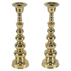 Pair of Polished Brass Asian Candlesticks
