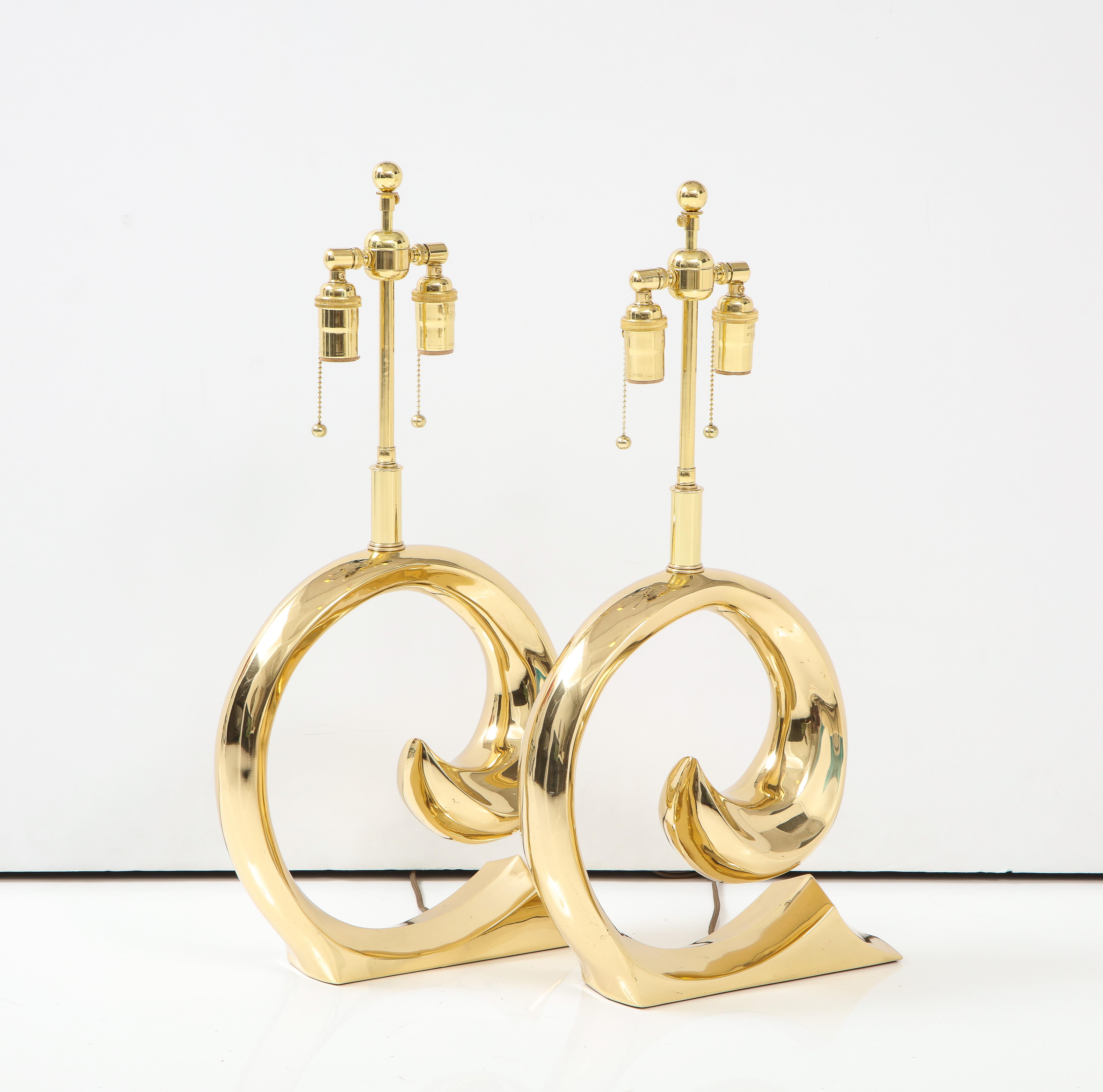 Pair of Pierre Cardin Logo lamps by Erwin Lambeth.
the lamps have beenNewly re polished and rewired with adjustable
polished brass double clusters  that take standard size light bulbs and silk rayon cords
Each socket takes up to 60 watts / 120 Watts