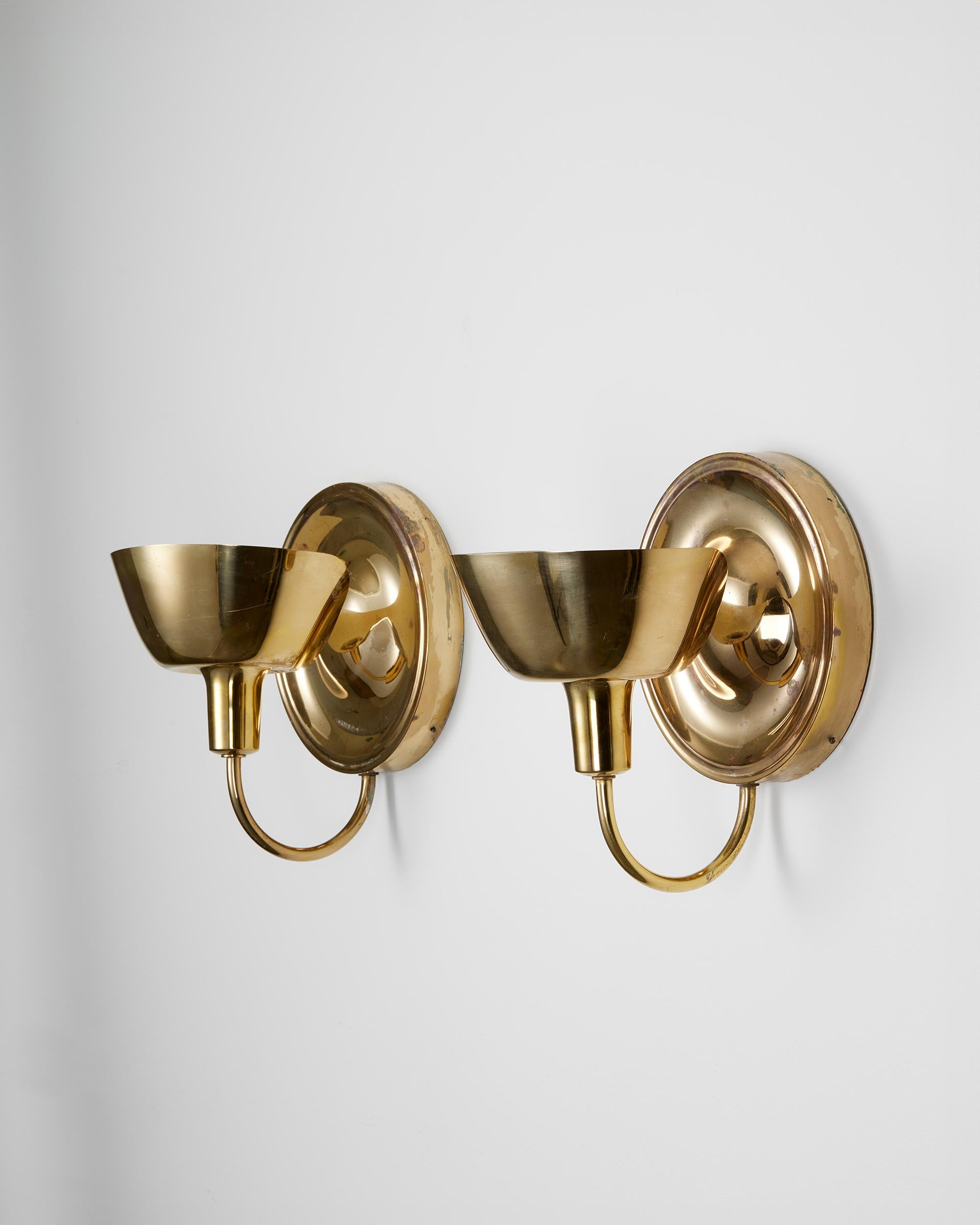 Pair of wall lights model 2389 designed by Josef Frank for Svenskt Tenn,
Sweden, 1950s.

Polished brass.

Josef Frank was a true European, he was also a pioneer of what would become classic 20th century Swedish design and the “Scandinavian Design
