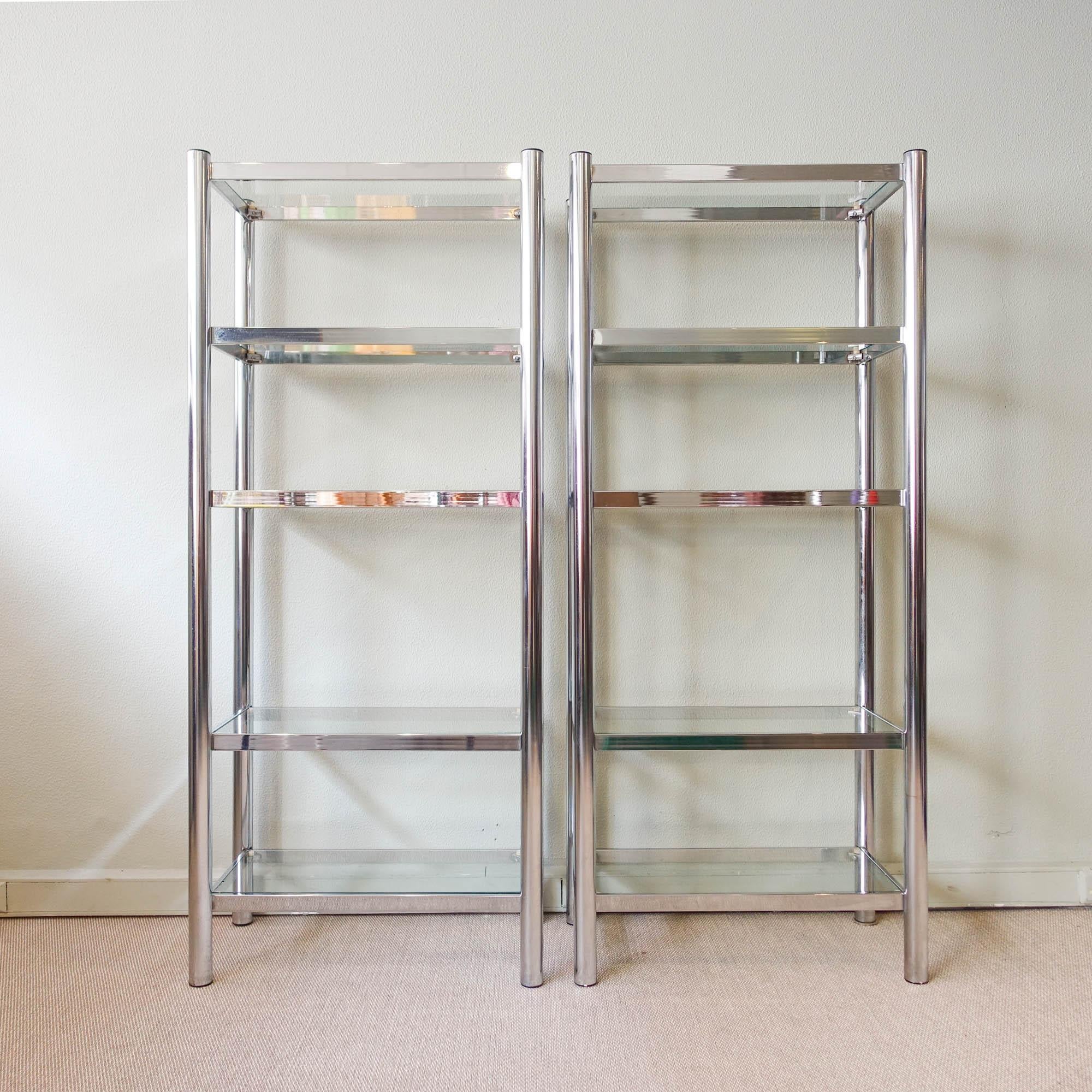 This gorgeous pair of polished chrome and glass shelving unit is a must-have for any vintage lover! Produced in Portugal during the 1970s, they feature a simple yet functional design that is perfect for displaying your favorite books and objects.