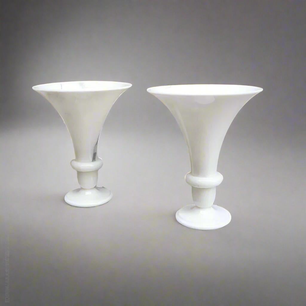 A pair of polished marble urn shaped table lamps.