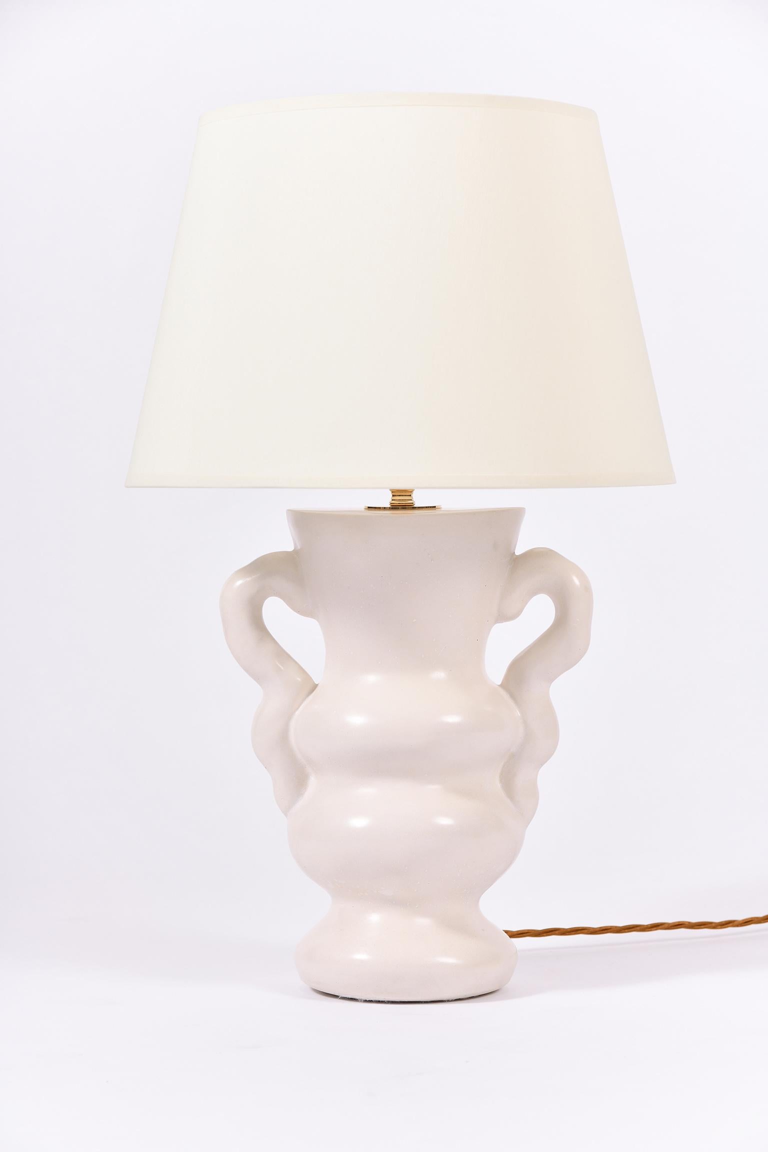 A pair of Ysolde table lamps, by Dorian Caffot de Fawes
Hand cast in London, polished and waxed high quality plaster
With a bespoke ivory fabric tapered shade.
With the shade: 57 cm high 36 cm diameter
Lamp base only: 36 cm high by 25 cm wide by 16
