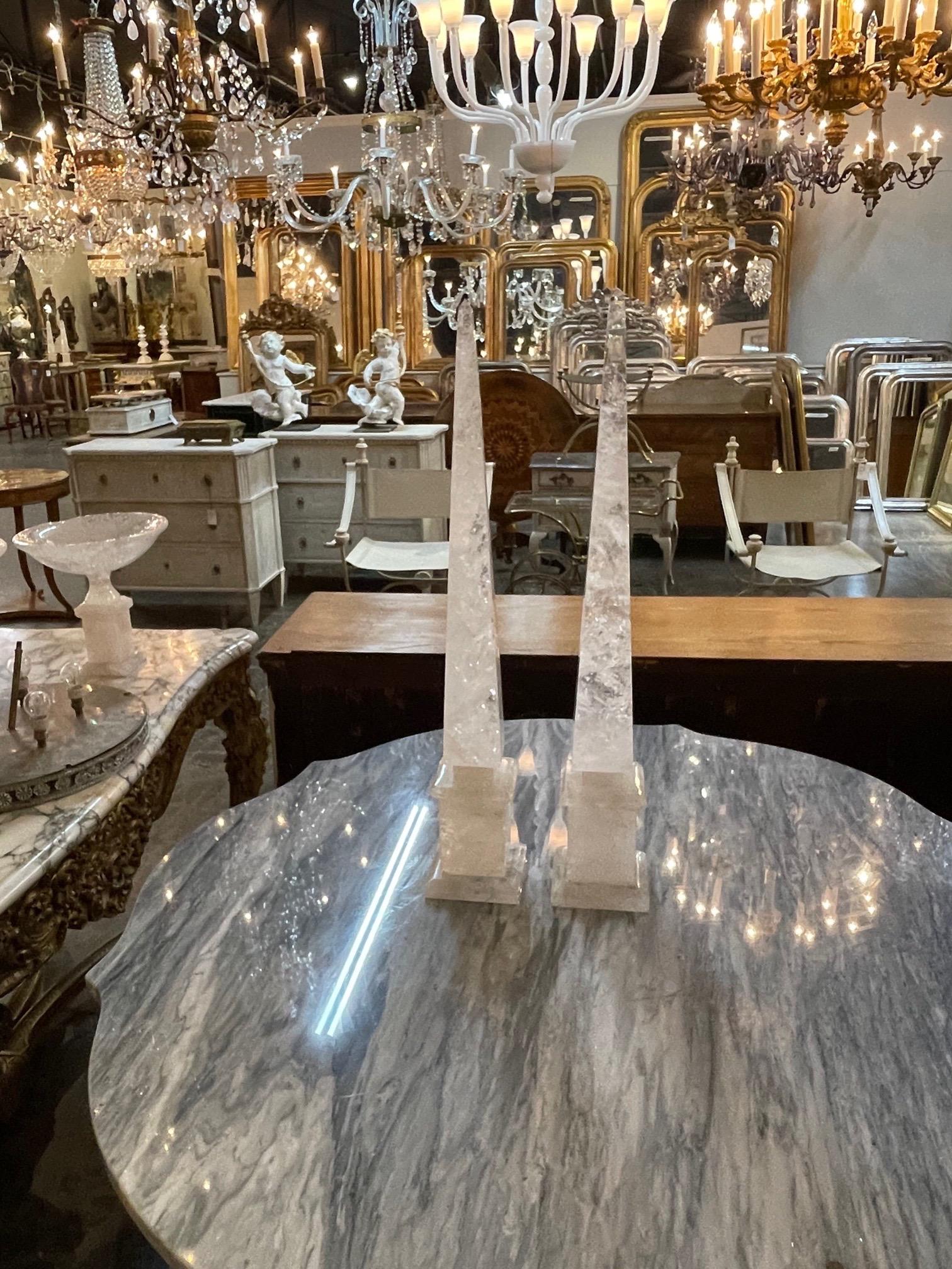 Very fine pair of polished rock crystal obelisks from South America. These are very fine quality and they make an impressive statement! A fabulous accessory.
