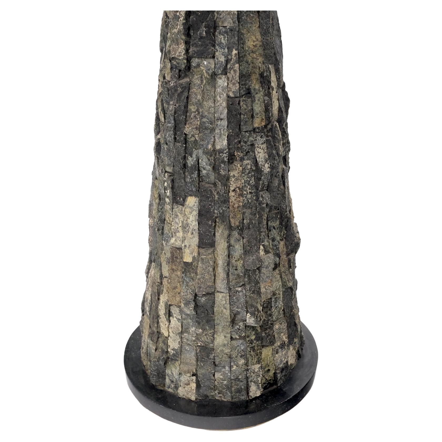 Pair of polished & rough stone tiles cone shape non matching pair of pedestals
small: 14 × 36

tall : 14 x 43.