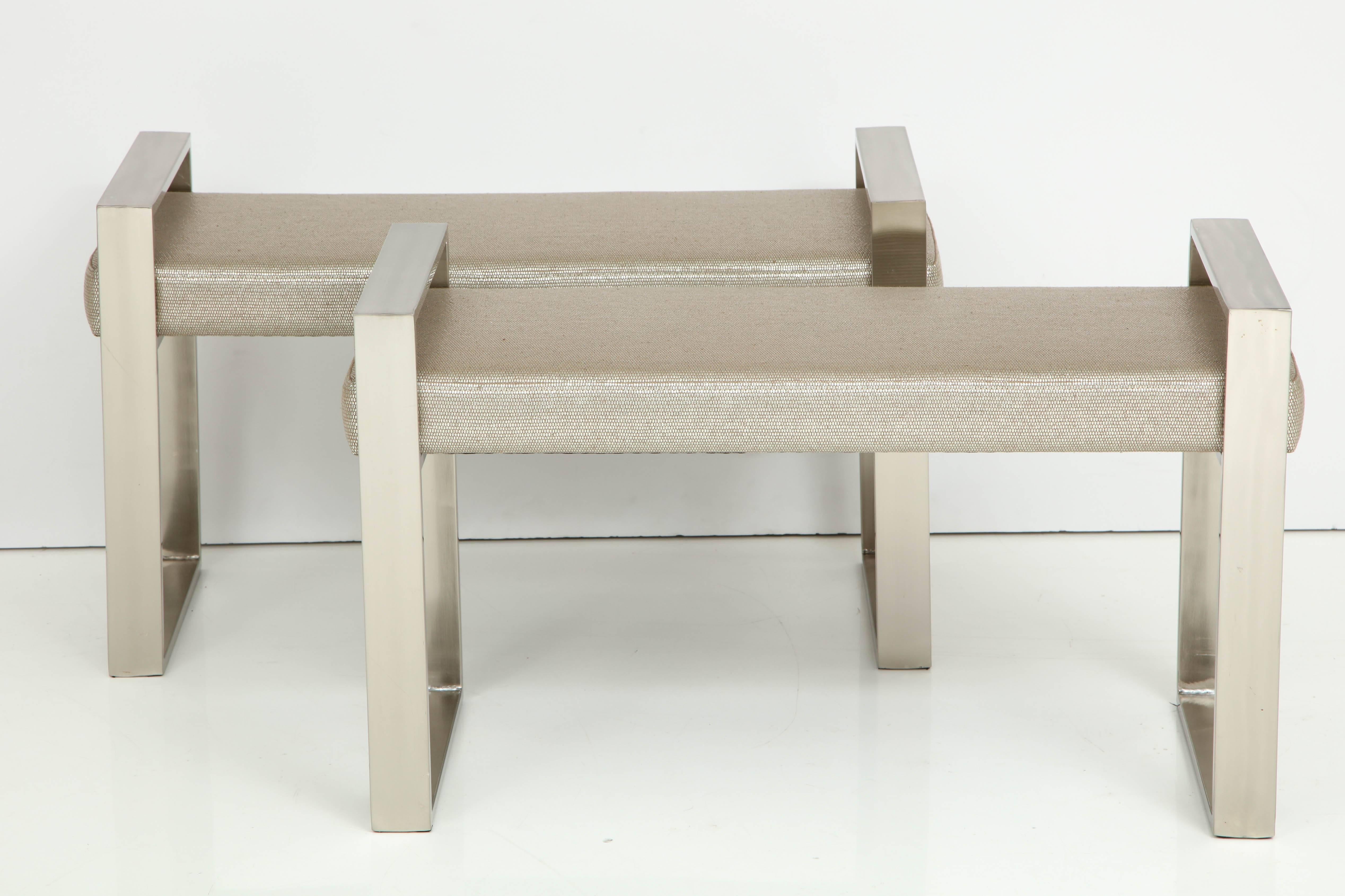 Pair of 1970s polished stainless steel benches newly reupholstered in a beautiful zinc textiles fabric for romo.
There are a couple of minimal light scratches consistent with age.
 