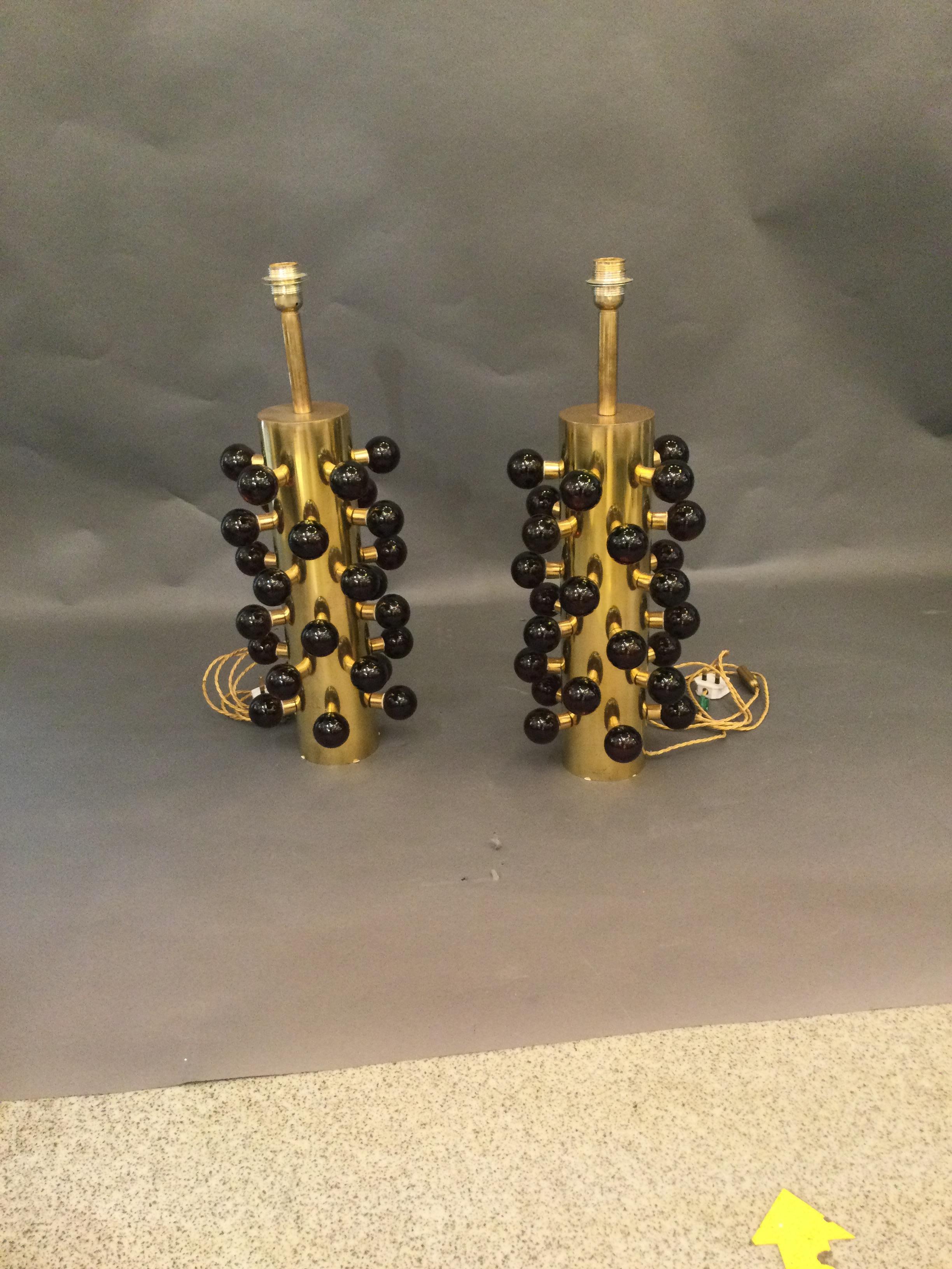 Pair of table lamps made of brass body and decorative murano glass spheres attached all over the lamps.